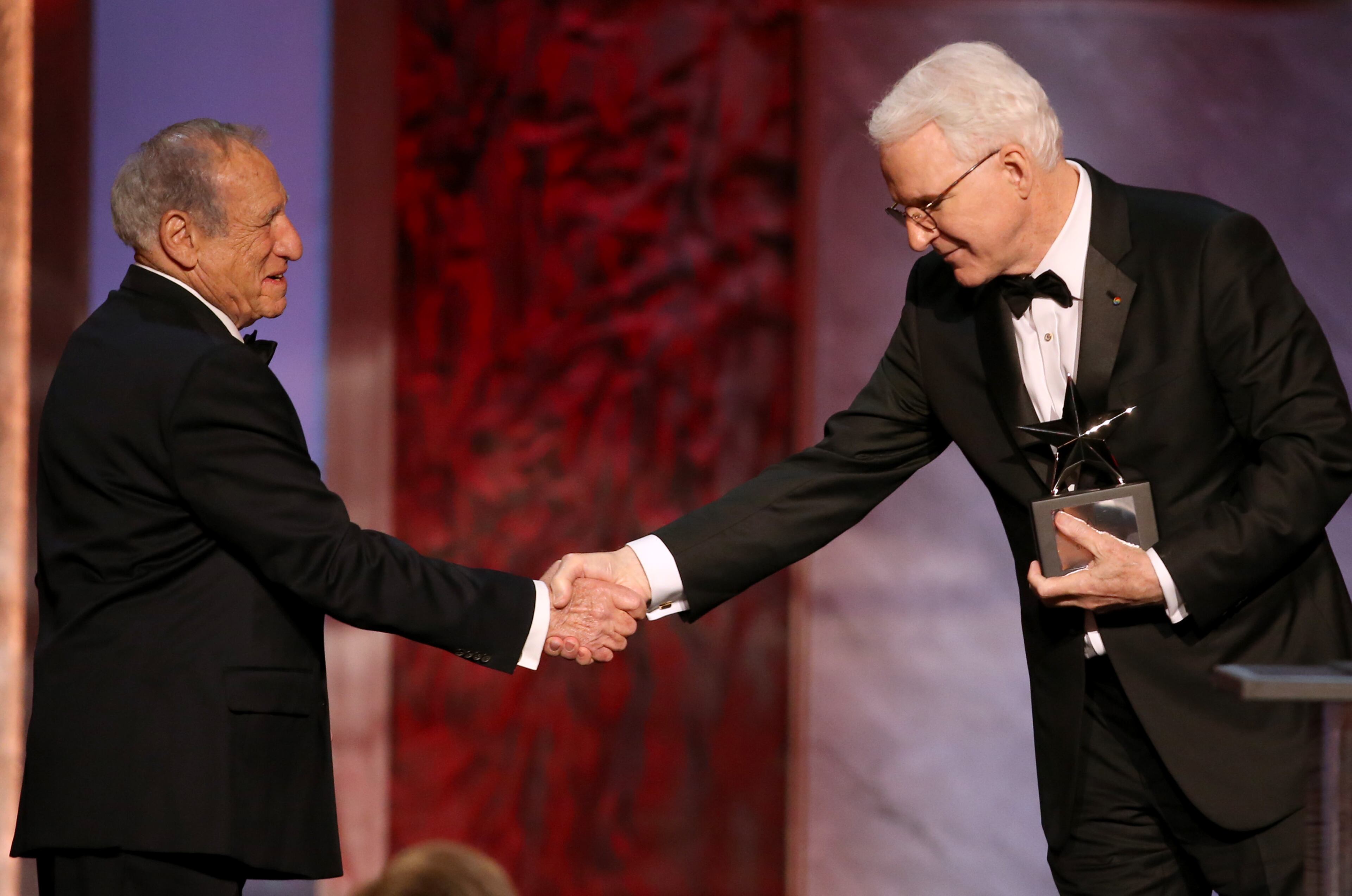 Mel Brooks, left, presents Honoree Steve Martin with his award at the 43rd AFI Lifetime Achievement Award Tribute Gala at the Dolby Theatre on Thursday, June 4, 2015, in Los Angeles. (Photo by Paul A. Hebert/Invision/AP)