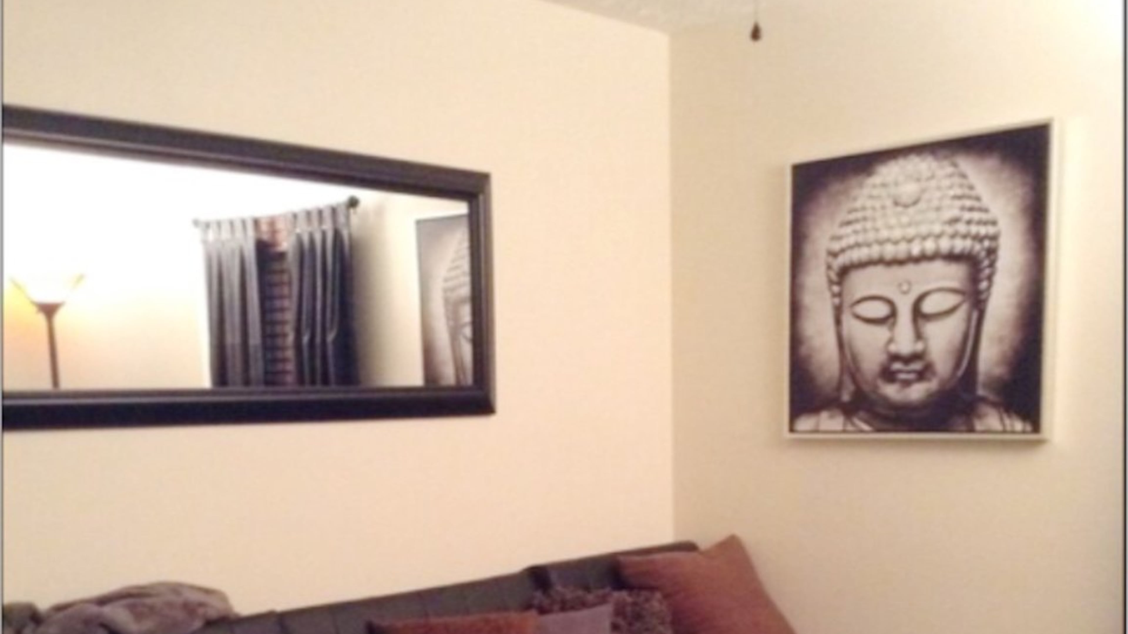 Buddhas are displayed prominently in Michelle Jackson’s Atlanta home because of their calming quality, she said. PHOTO CREDIT: Michelle Jackson