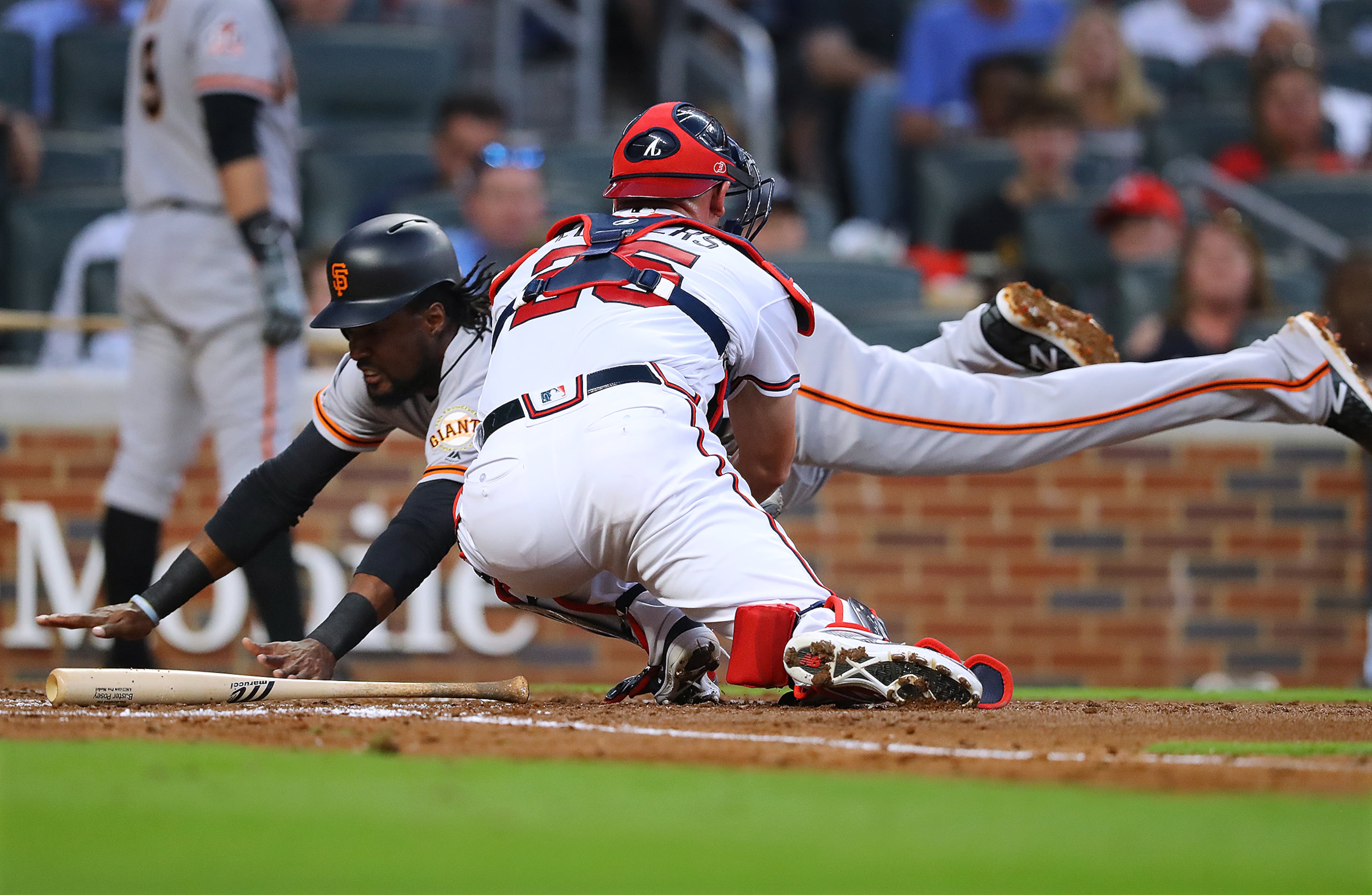 May 4, 2018 Atlanta: Atlanta San Francisco Giants Alen Hanson is called out diving home past Braves catcher Tyler Flowers during the second inning in MLB baseball game on Friday, May 4, 2018, in Atlanta. The Giants challenged the call and upon review Hanson was ruled safe to score a run. The Giants scored 6 runs during the second inning. Curtis Compton/ccompton@ajc.com