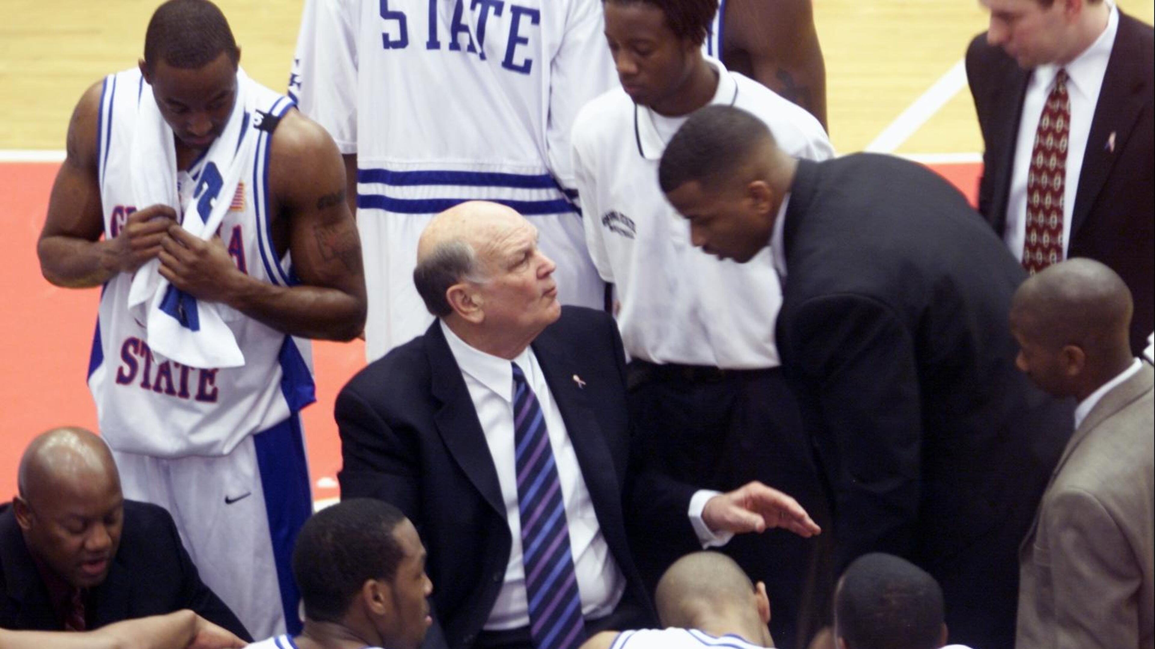 Lefty Driesell, center, coaches Georgia State in 2002.