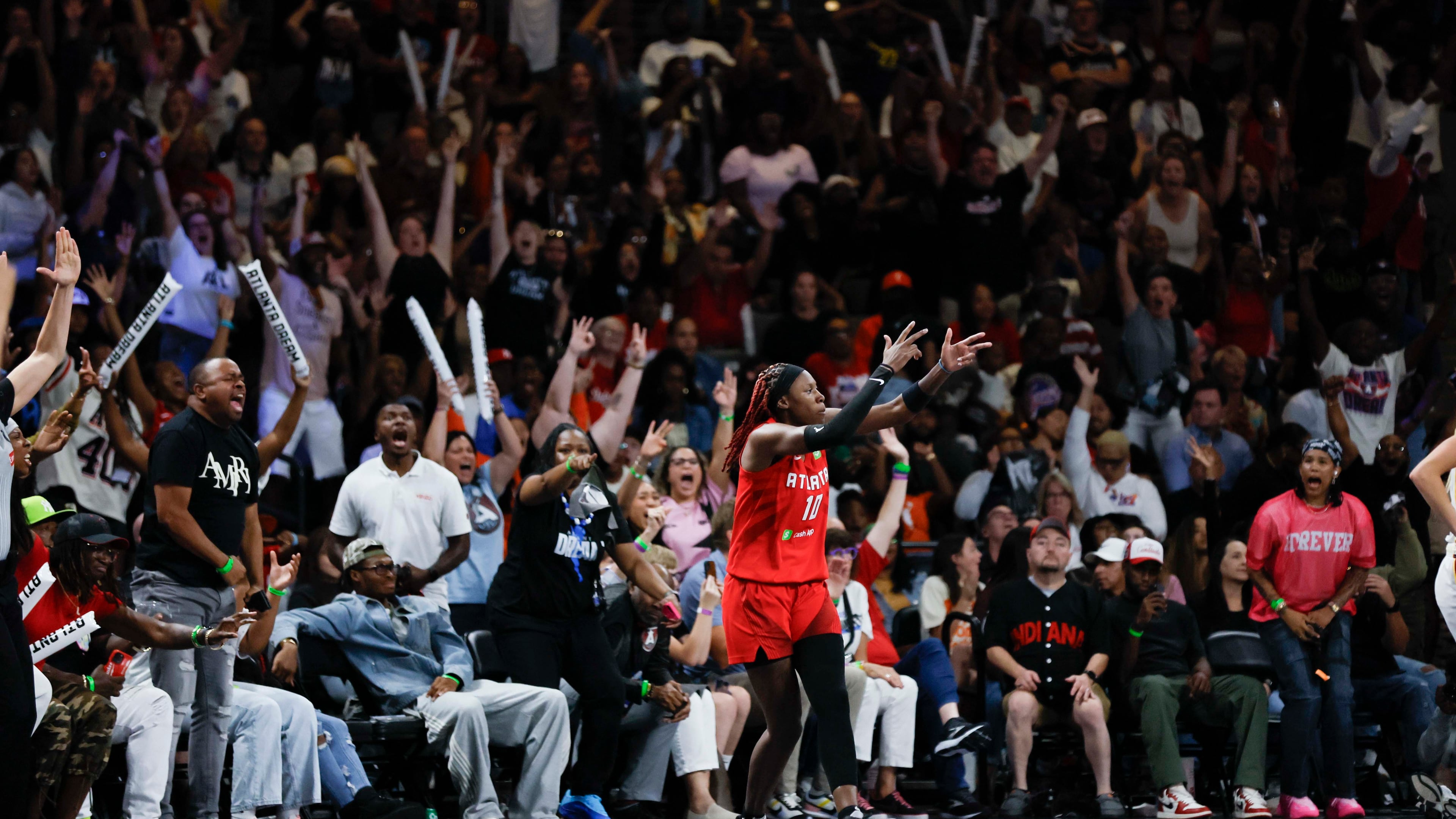 Dream guard Rhyne Howard celebrates after hitting a 3-pointer against the Indiana Fever at Gateway Center Arena on Thursday, Sept. 18, 2024, in Atlanta. The WNBA team is building quite a fan base. (Miguel Martinez/AJC 2024)