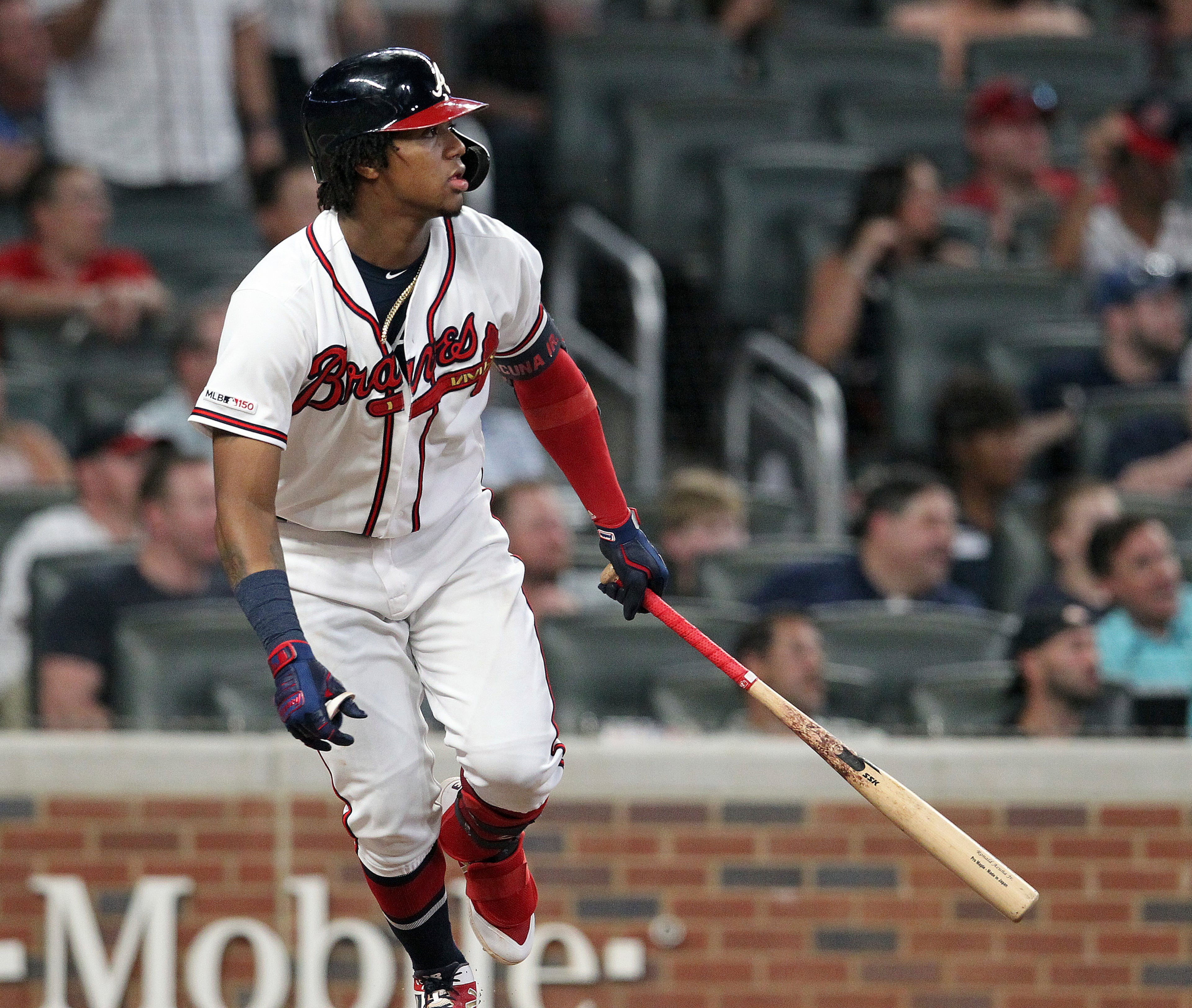 Atlanta Braves' Ronald Acuna Jr. watches his single against the Miami Marlins in the ninth inning of a baseball game Thursday, Aug. 22, 2019, in Atlanta. (AP Photo/Tami Chappell)