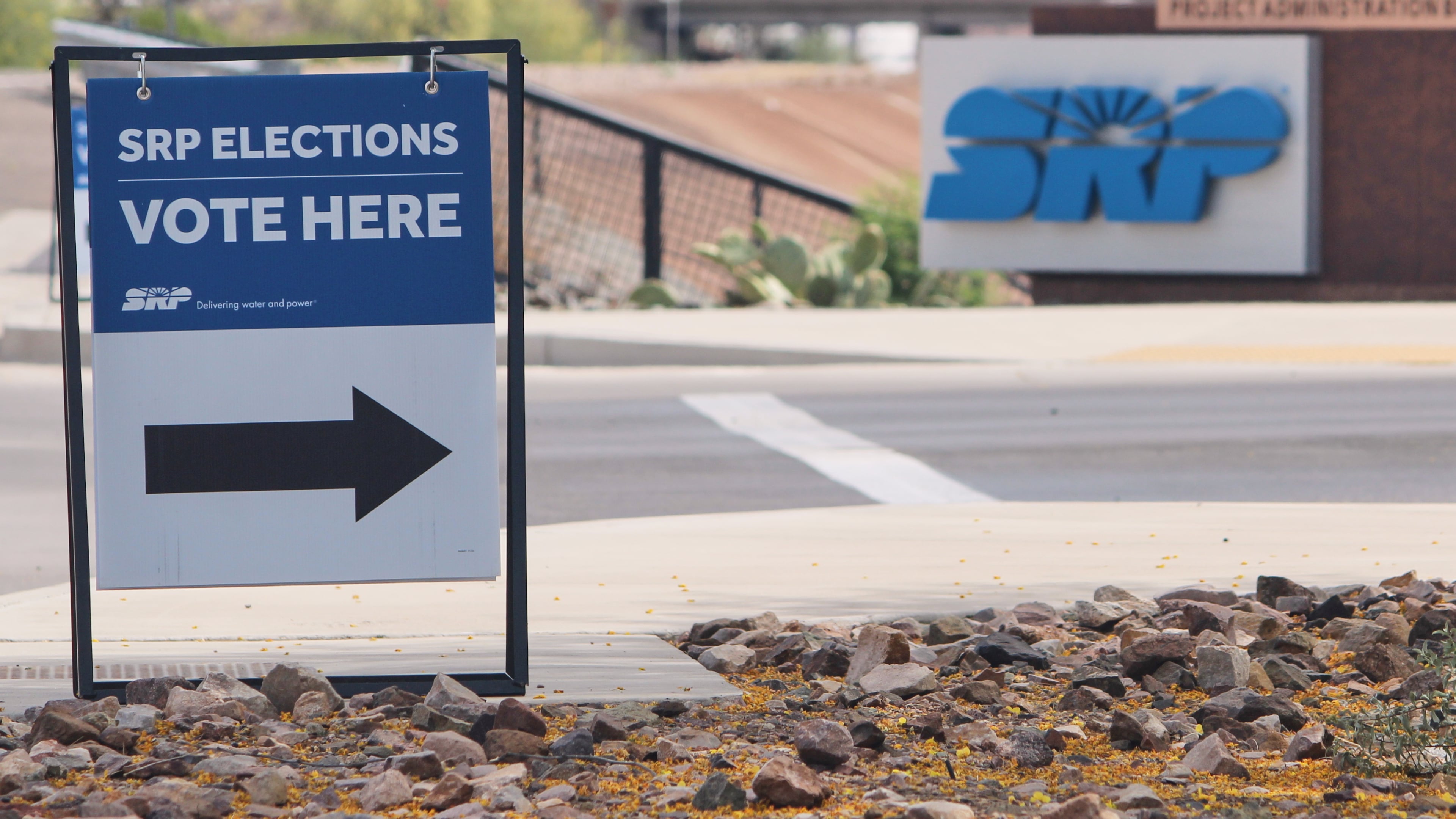 A sign directing voters sits outside the headquarters of Salt River Project on Monday, March 30, 2026, in Tempe, Ariz. (AP Photo/Jonathan J. Cooper)