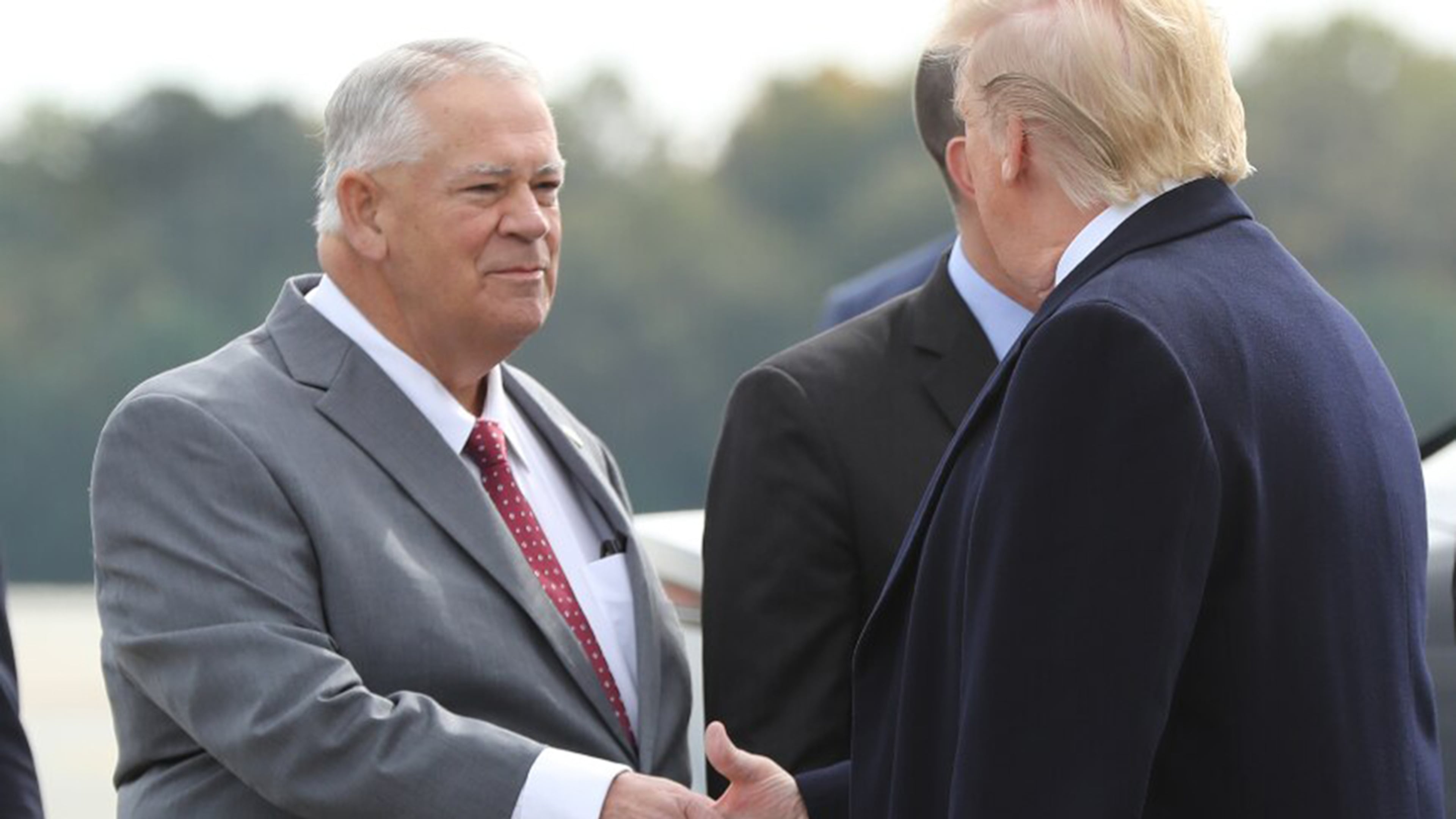 Speaker of the Georgia House of Representatives David Ralston (left) greets President Donald Trump as he arrives at Dobbins Air Force Base in November 2019. (AJC file)