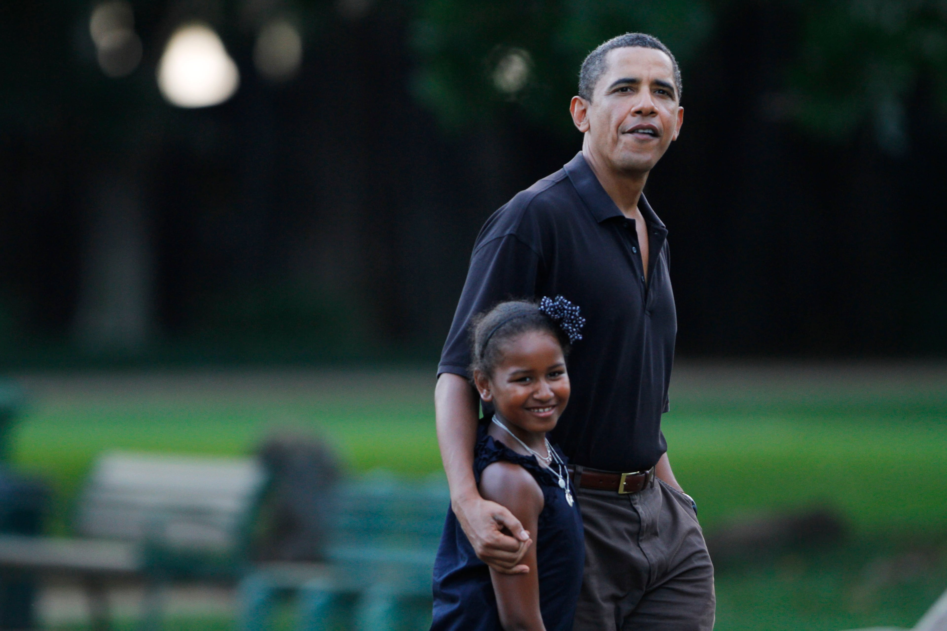 U.S. President Barack Obama and his youngest daughter Sasha, 8, walk through the Honolulu Zoo on Sunday, January 3, 2009 in Honolulu, Hawaii. Obama and his family are spending the holidays in his native Hawaii. (Photo by Kent Nishimura-Pool/Getty Images)