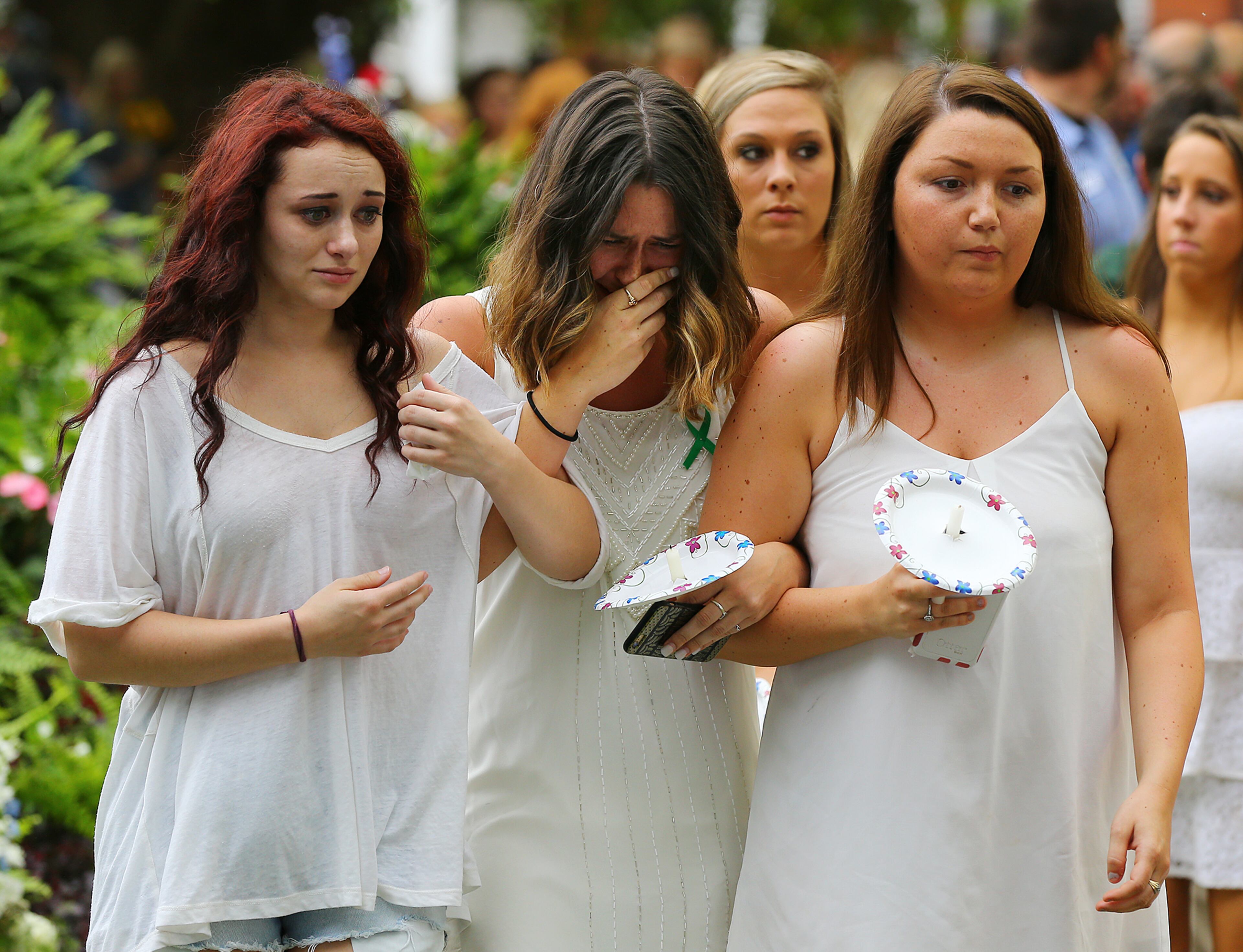 Kappa Delta sorority members arrive arm-in-arm for the Memorial Service on Sweetheart Circle at Georgia Southern University. Curtis Compton / ccompton@ajc.com