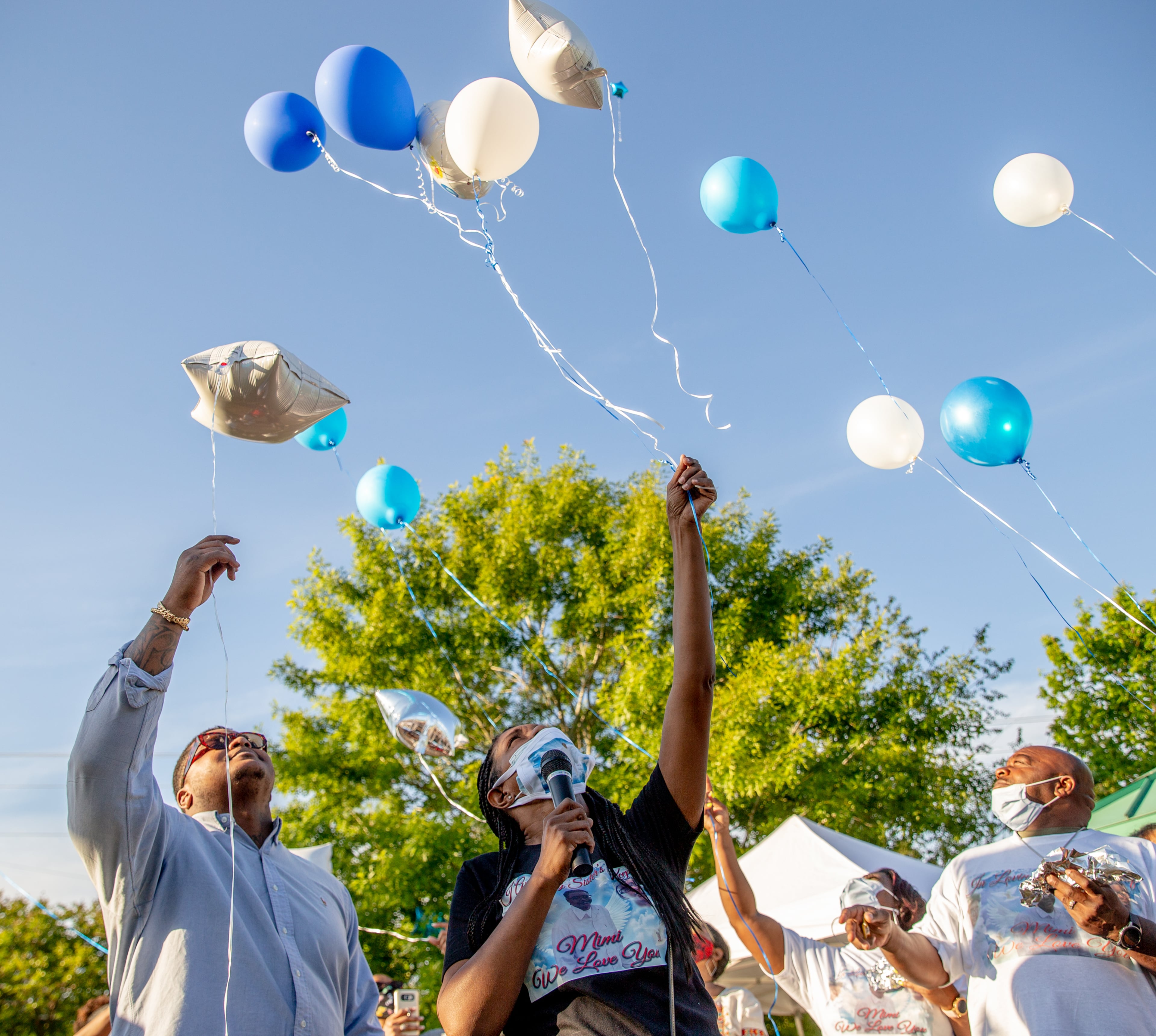 Family and friends of Normisha “MiMi” Monroe, including her brother, Brice Smith (left) and sister Tamika Gooden (center), release balloons at a gather Saturday, May 1, 2021, at Club Drive Park in Lawrenceville to celebrate the life of the 38-year-old, and five other women, who died in an interstate crash a week earlier. There was a balloon release at the park, dancing Care Bears and Monroe’s best friend at the turntables. (Photo: Jenni Girtman for The Atlanta Journal-Constitution)