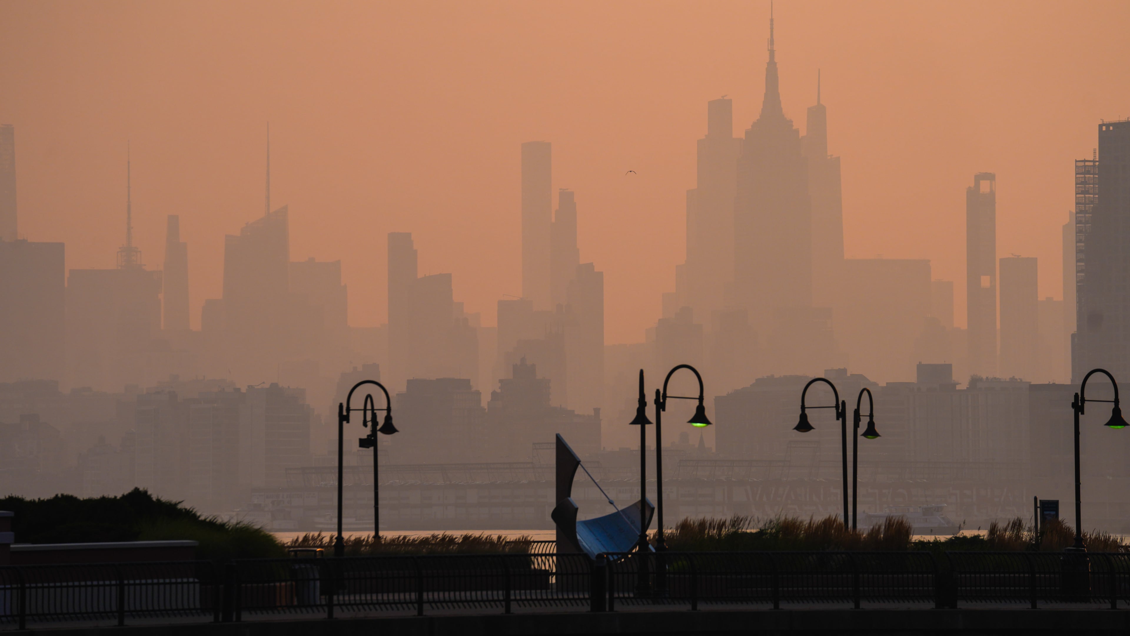 The New York City skyline is seen through a cover of wildfire smoke, in Jersey City, N.J., Friday, July 17, 2026. (AP Photo/Ryan Murphy)