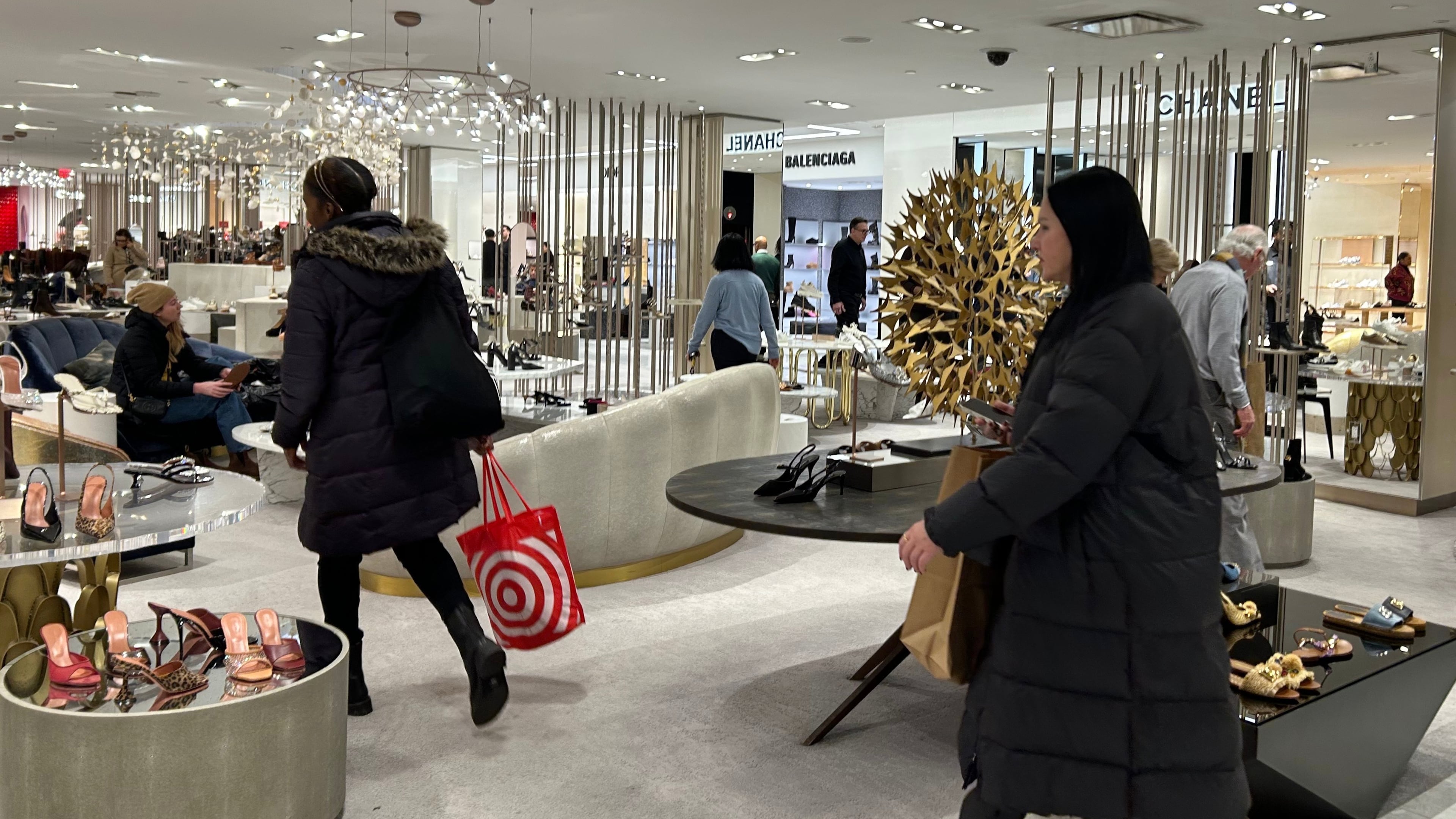 FILE - Shoppers walk through Saks Fifth Avenue, Jan. 16, 2026 in New York. (AP Photo/Anne D'Innocenzio, File)