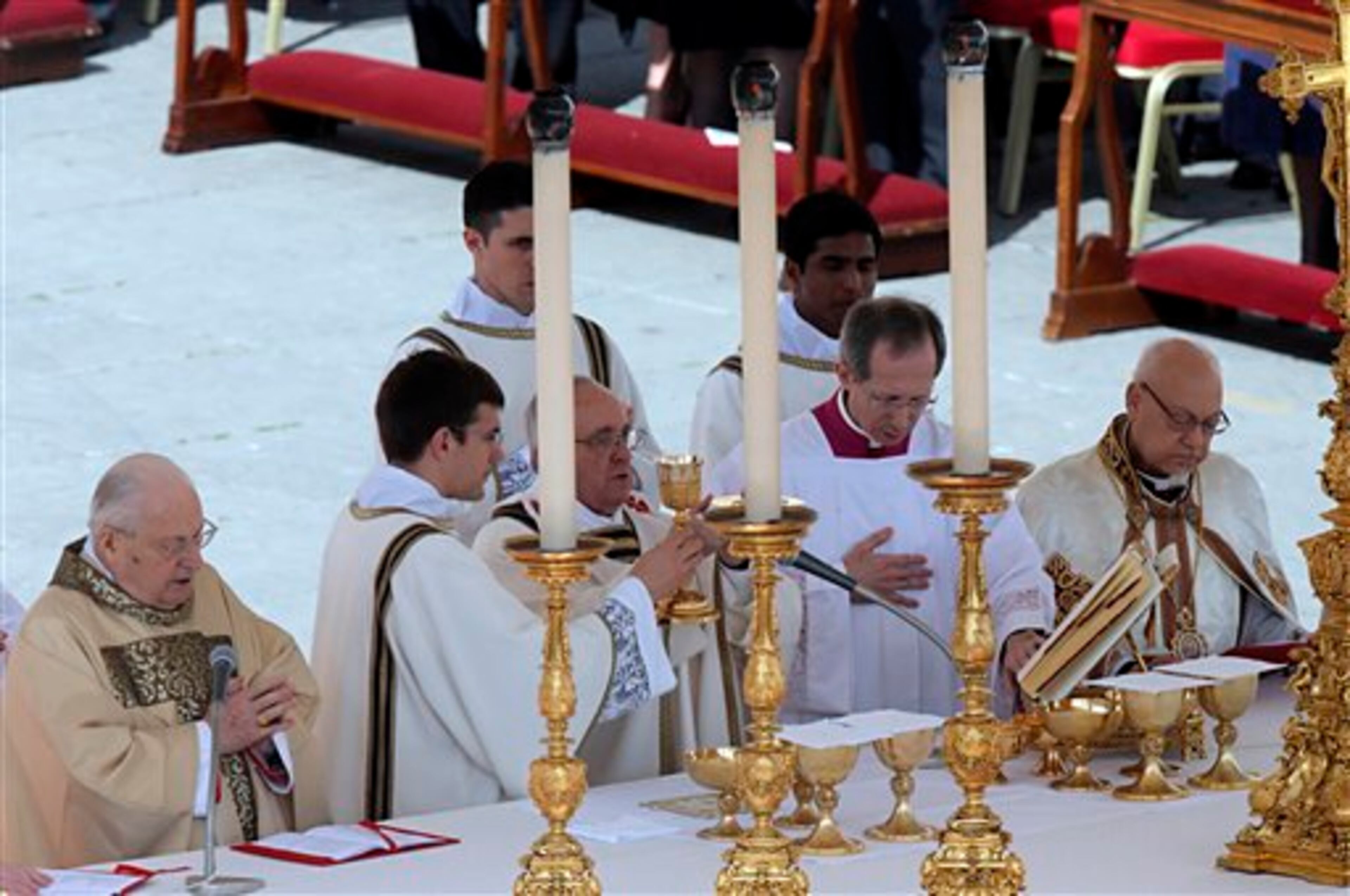 Pope Francis celebrates his installation Mass in St. Peter's Square at the Vatican, Tuesday, March 19, 2013. Pope Francis has urged princes, presidents, sheikhs and thousands of ordinary people gathered for his installation Mass to protect God's creation, the weakest and the poorest of the world. (AP Photo/Dmitry Lovetsky)