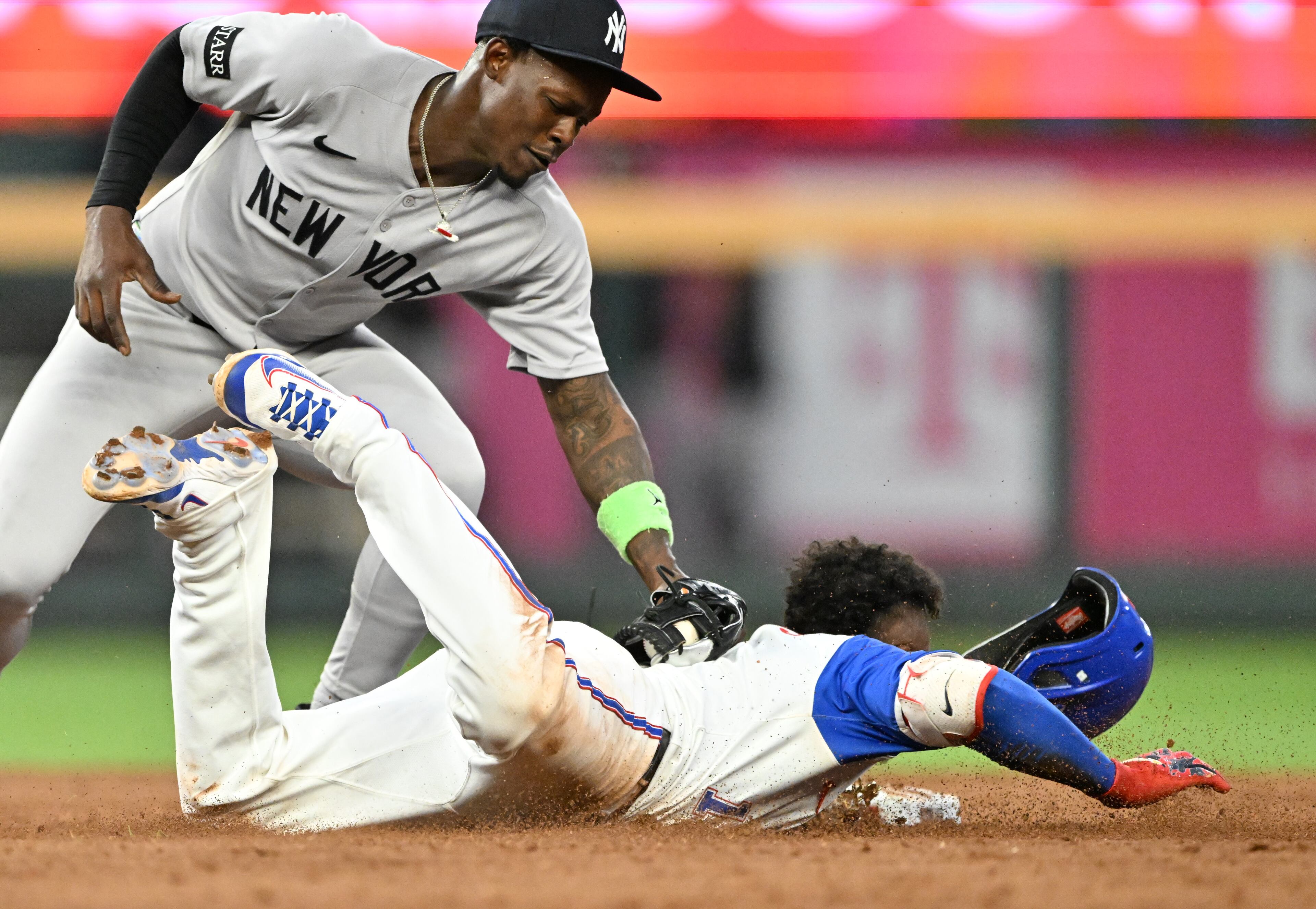 Atlanta Braves second base Ozzie Albies (1) steals second base as New York Yankees second base Jazz Chisholm Jr. (13) applies a late tag during the fifth inning of a baseball game at Truist Park, Saturday, July 19, 2025, in Atlanta. New York Yankees won 12-9 over Atlanta Braves. (Hyosub Shin / AJC)