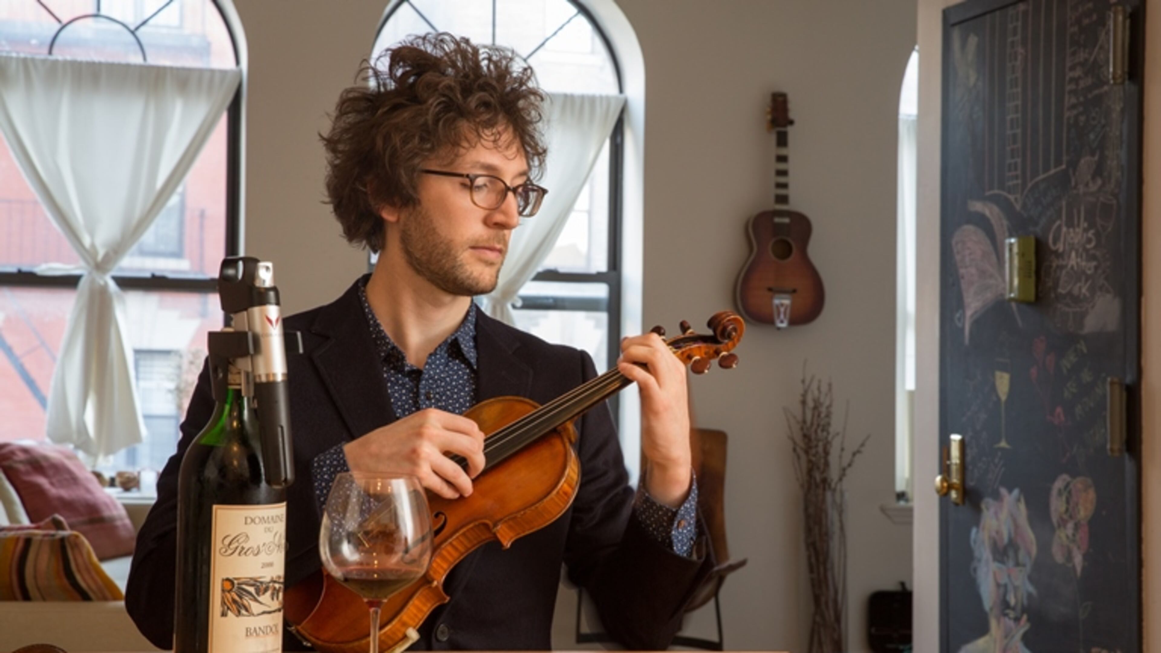 Rob Moose, a rock guitarist, violinist and producer, with his Coravin, which acts like a hypodermic syringe to draw out wine while fending off oxidation, in New York, Oct. 23, 2015. When clasped around a bottle’s throat, the tool pierces the cork with a hollow surgical-grade needle and injects argon, an inert gas, creating pressure and forcing a small amount of wine out through the needle while protecting the remainder from oxidation.