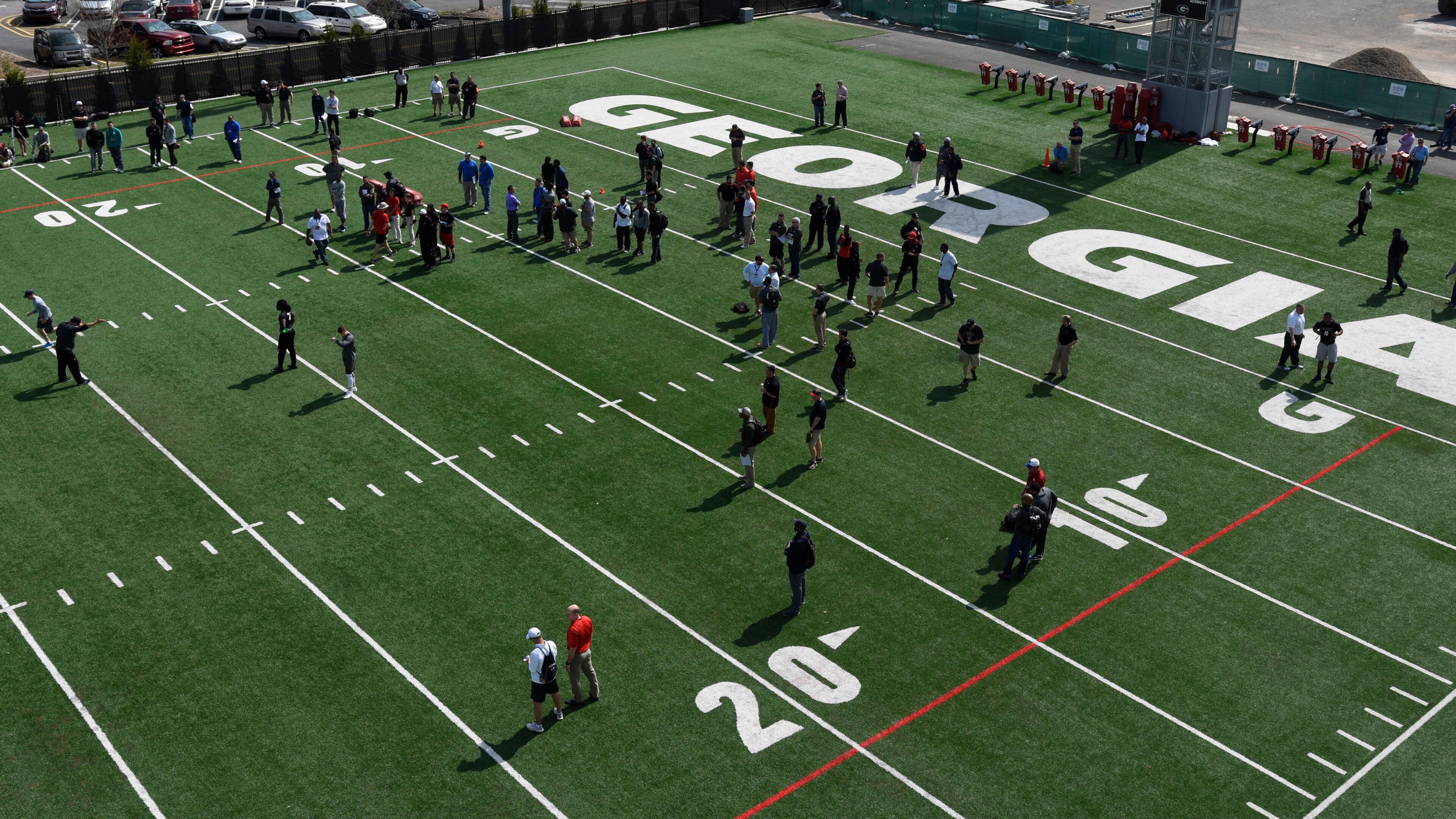 NFL scouts watch members of the Georgia football team during UGA Pro Day at Butts-Mehre Heritage Hall on Wednesday, Mar. 16, 2016 in Athens, Ga. (Photo by David Barnes)