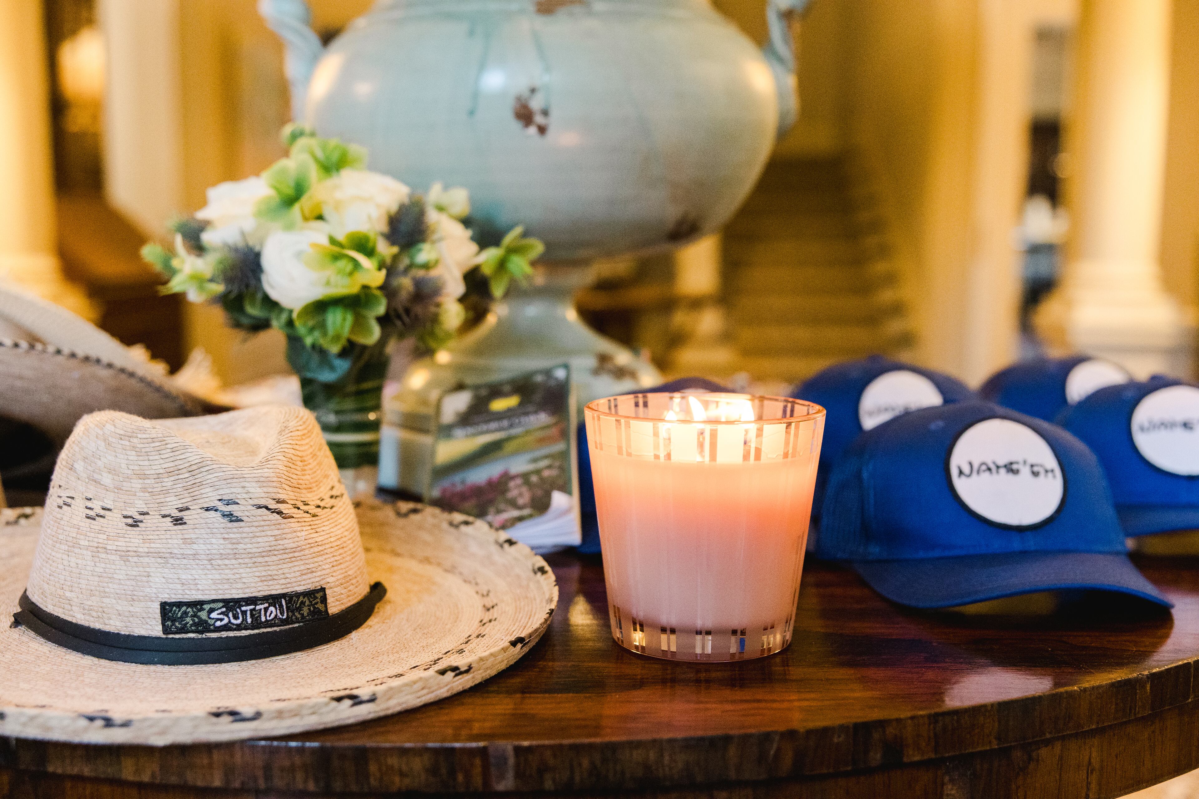 During last year's Masters Tournament party, guests were greeted with sun hats and branded caps at the welcome table.