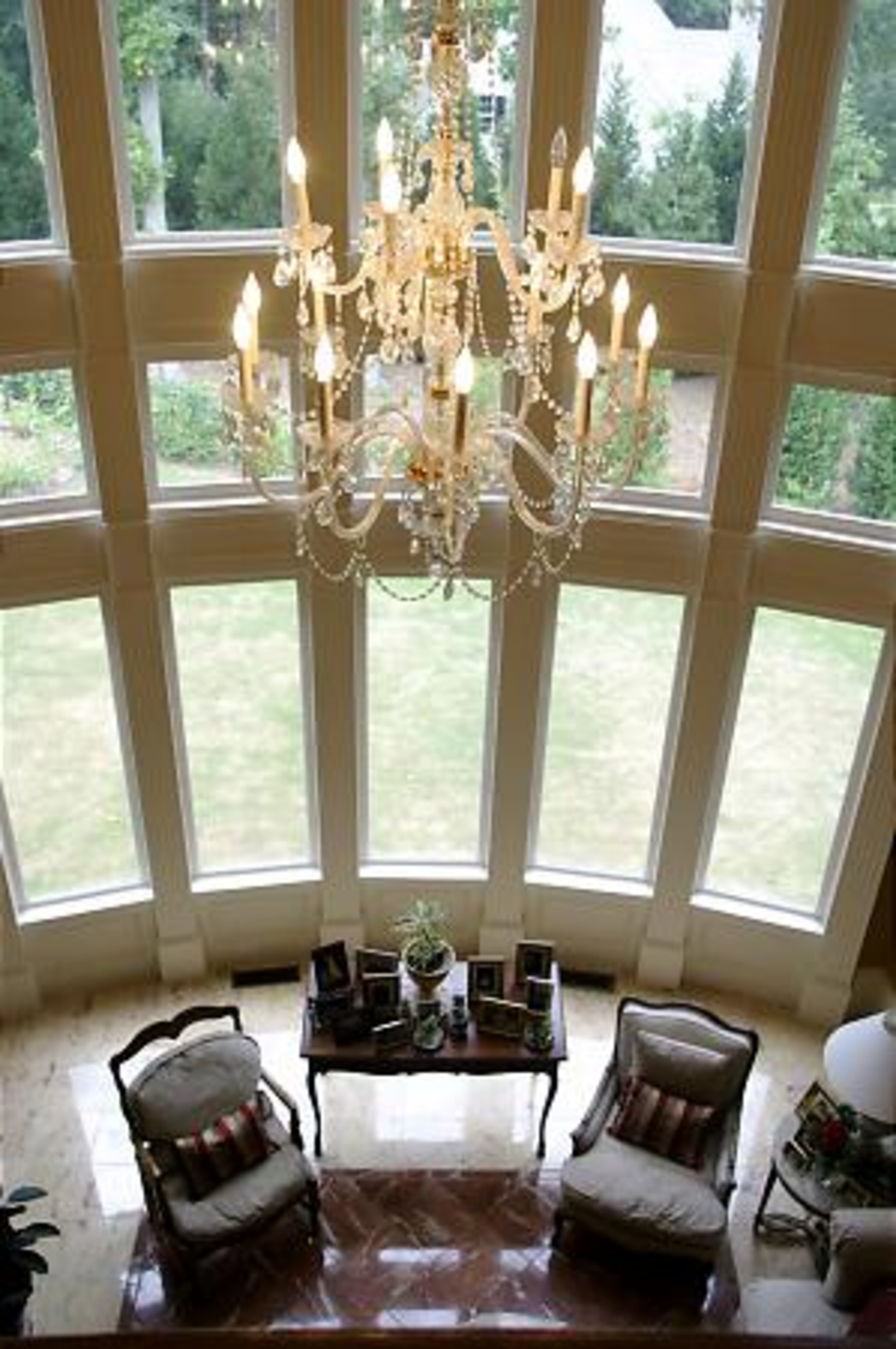A view from above the formal living room. The Gavenchaks bought all the Italian marble and chandeliers for their home before they started building. Their preparation kept the building process on track.