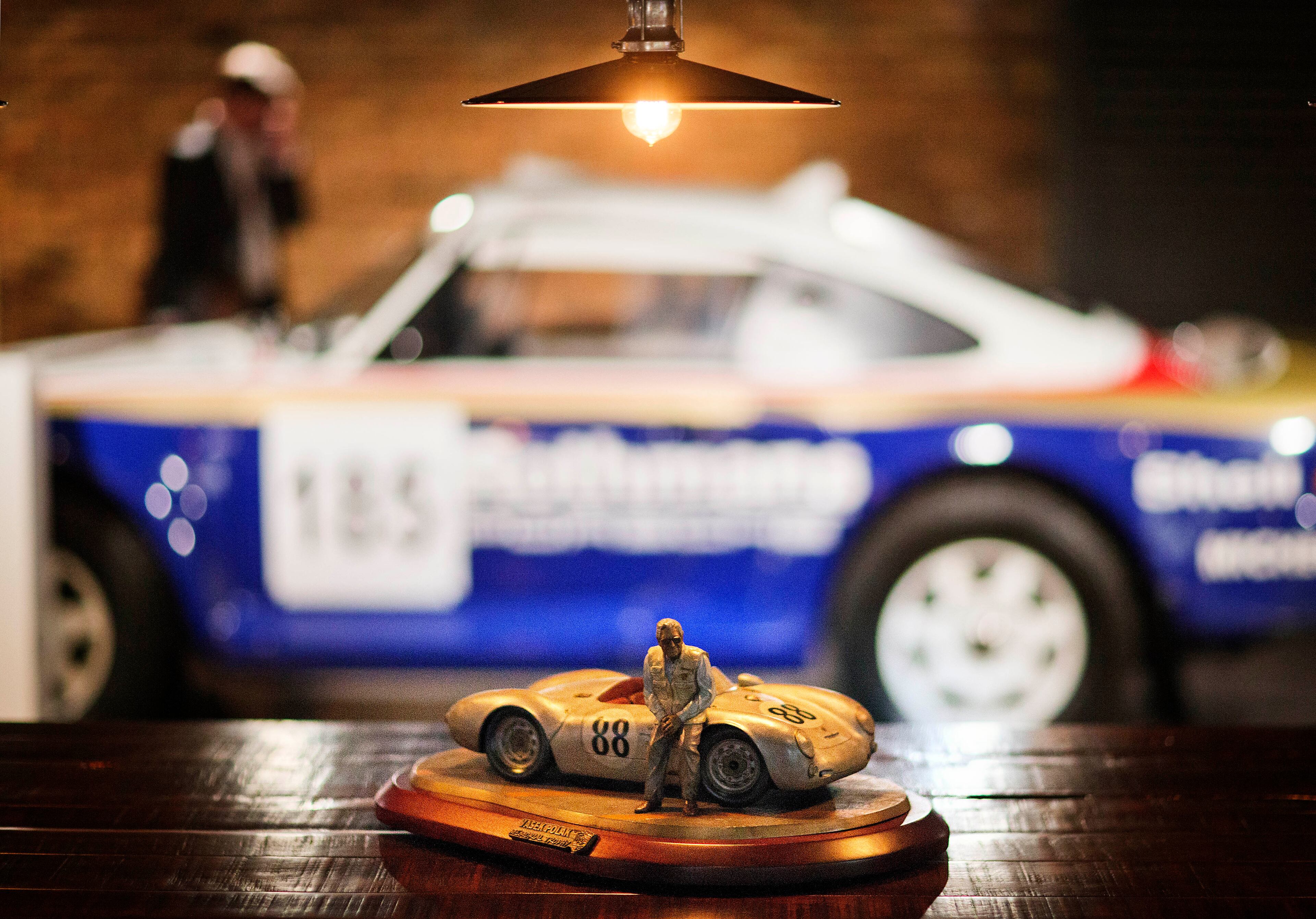A trophy named after Vasek Polak, who opened the first exclusive Porsche dealership in the United States, sits on a a dining table in an event space at the company's new North American headquarters, dubbed the Porsche Experience Center, Thursday, May 7, 2015, in Atlanta. The $100 million facility is an industry first in the United States and only their third globally. (AP Photo/David Goldman)
