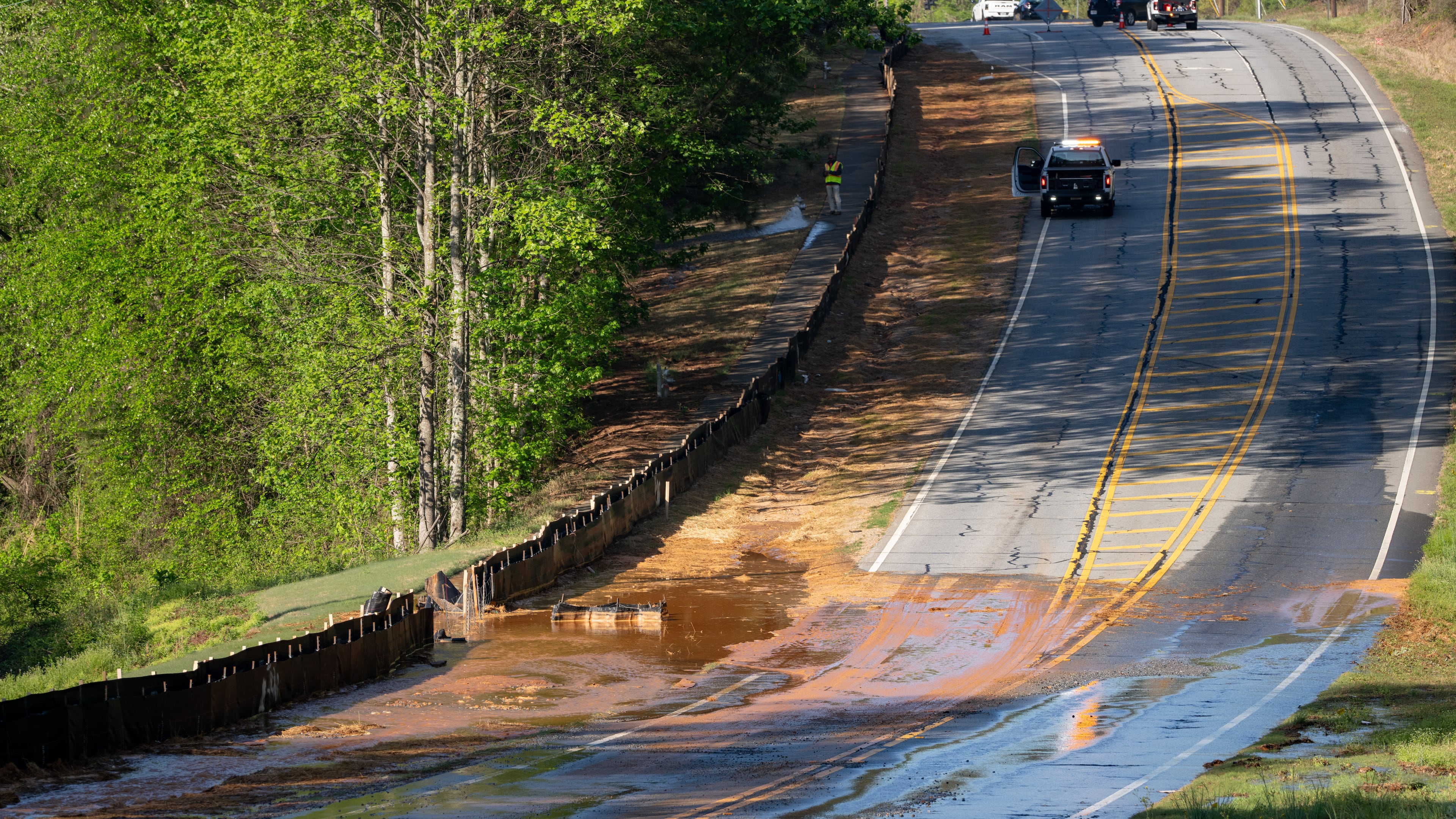 A section of Buford Highway, between Duluth and Suwanee, is closed as crews repair a water main break on Tuesday, April 14, 2026. (Ben Hendren for the AJC)