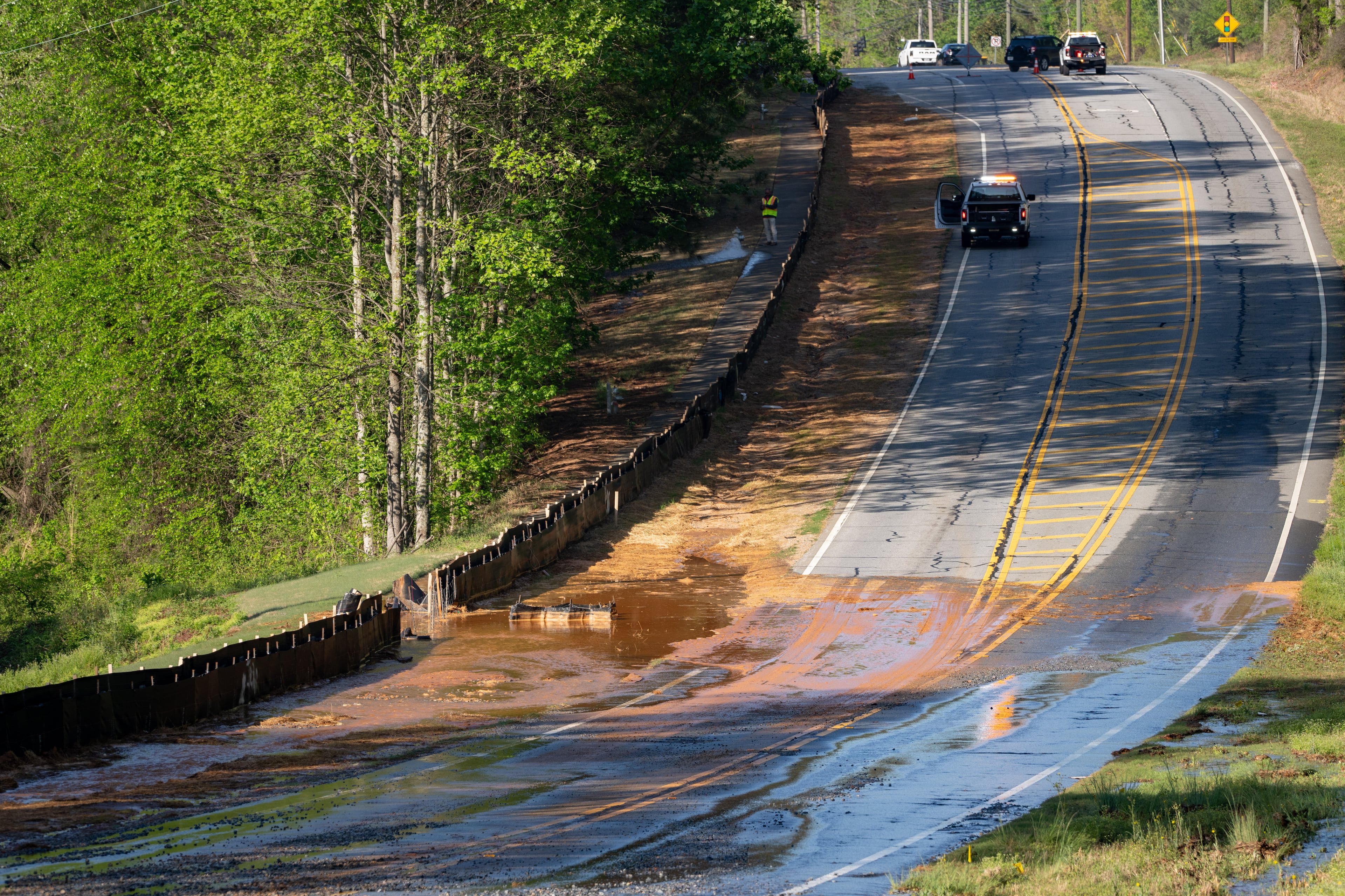 A section of Buford Highway, between Duluth and Suwanee, is closed as crews repair a water main break on Tuesday, April 14, 2026. (Ben Hendren for the AJC)