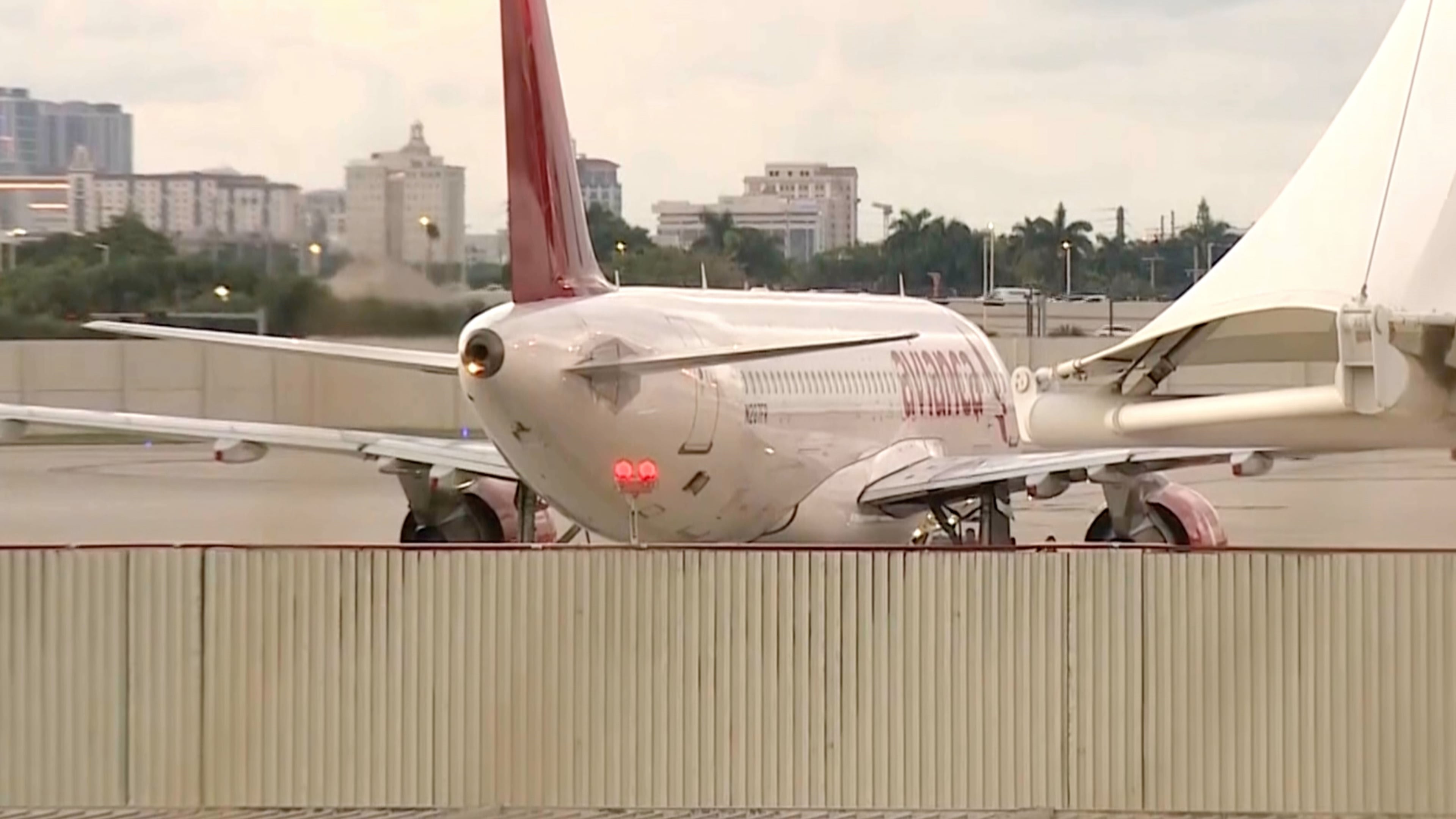 In this image from video, the Avianca Airlines plane which had encountered severe turbulence and had to make an emergency landing, is parked at Miami International Airport in Miami, on Friday, Oct. 9, 2026. (WSVN/ABC Miami via AP)