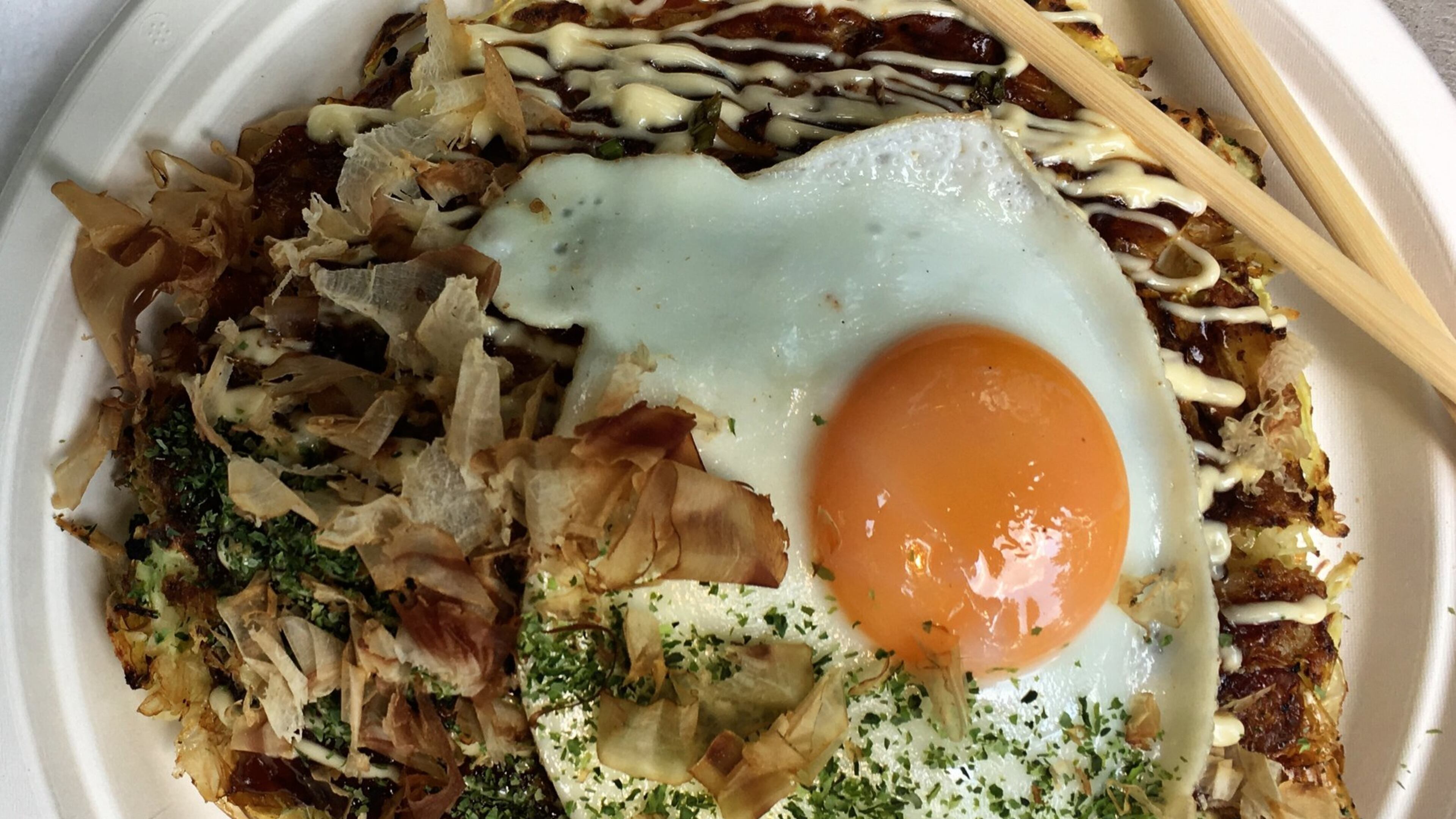 The pleasure of okonomiyaki at Ok Yaki is all about contrasting textures and flavors. CONTRIBUTED BY WYATT WILLIAMS