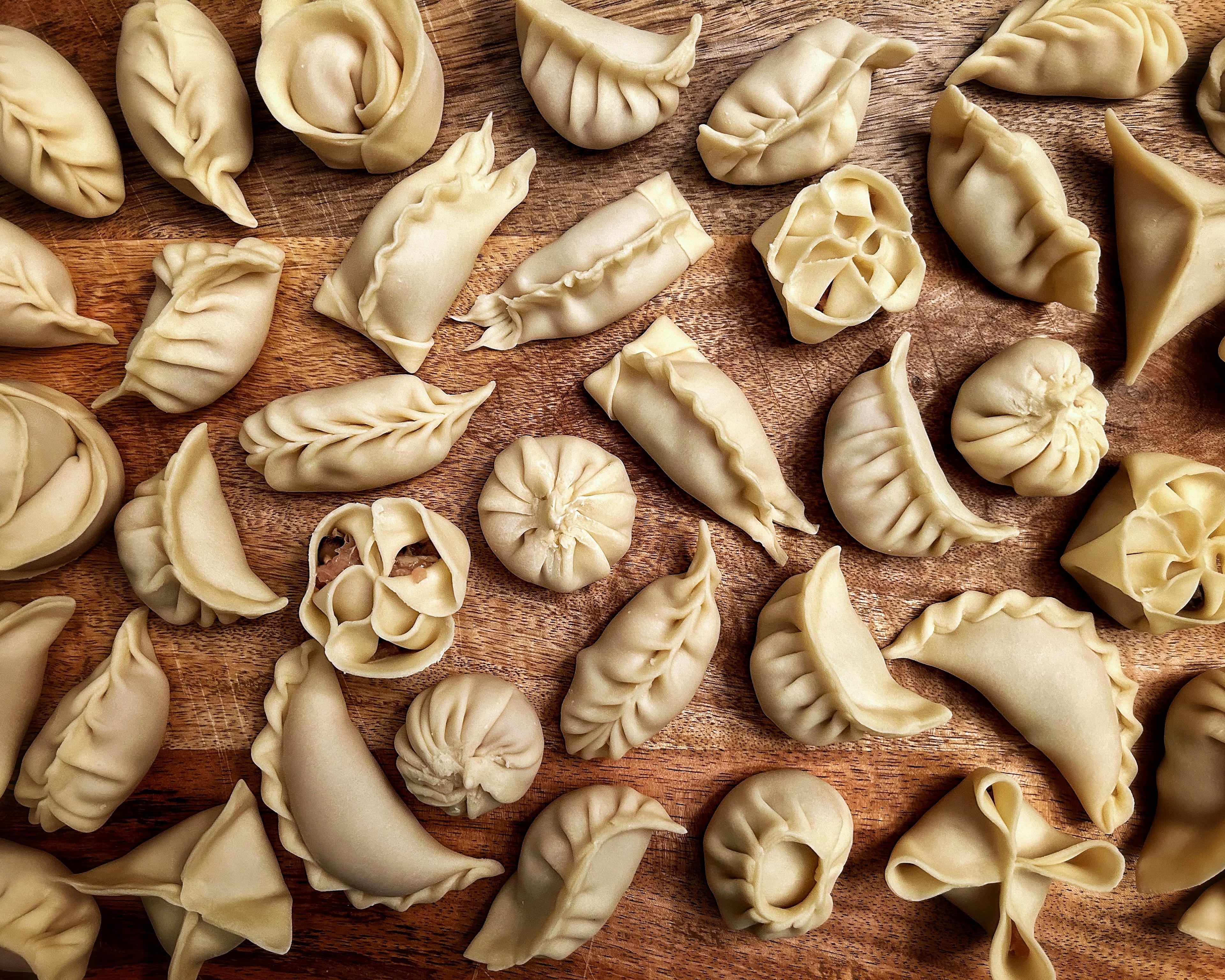 Various pleating techniques can be used, as long as the dumpling is sealed shut. (Candy Hom for the AJC)
