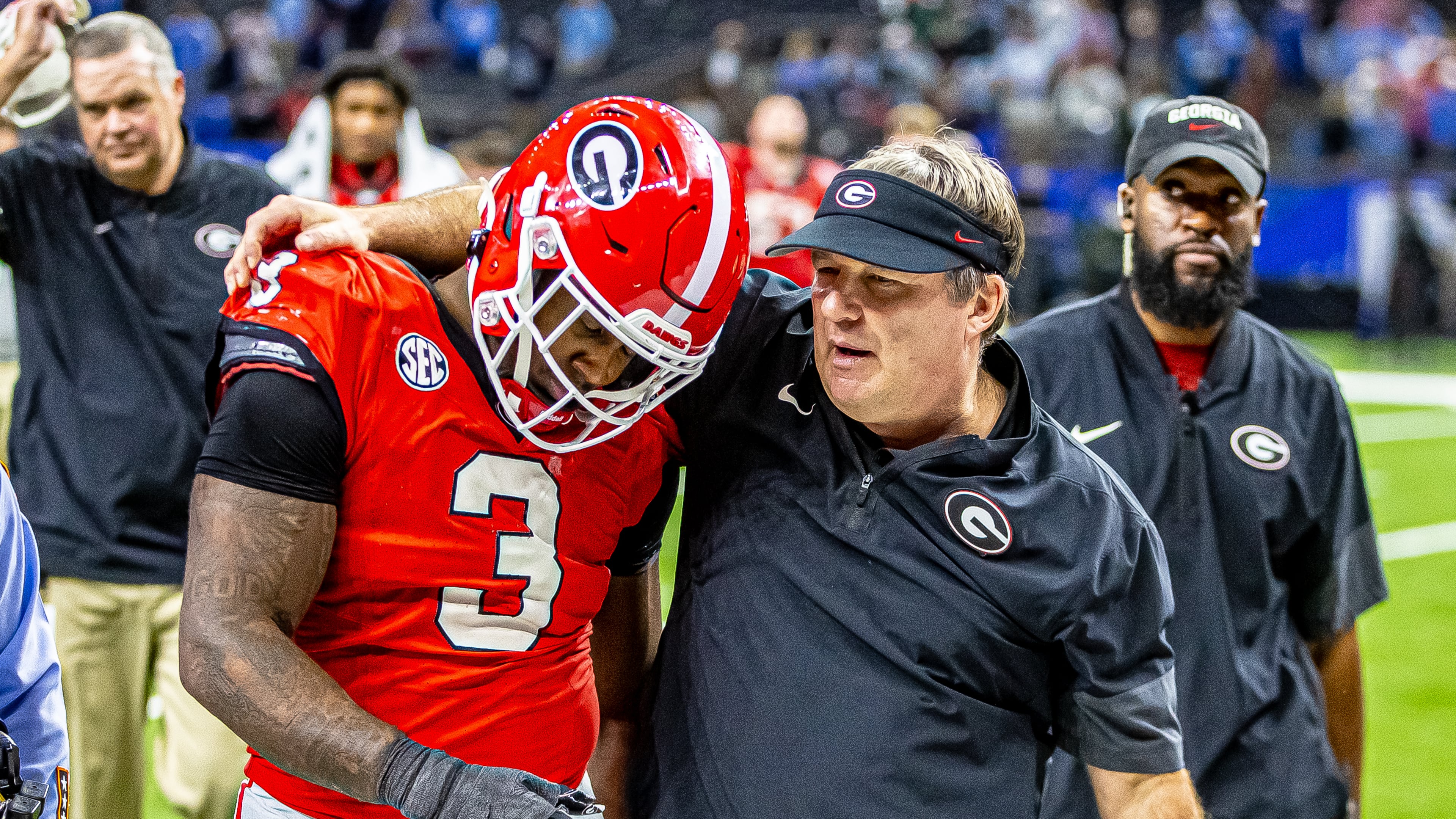 Georgia coach Kirby Smart (right) consoles junior linebacker CJ Allen after the Bulldogs fell 39-34 to Ole Miss in a quarterfinal playoff game on Jan. 1, 2026, at Caesars Superdome in New Orleans. (Jeff Sentell/DawgNation)