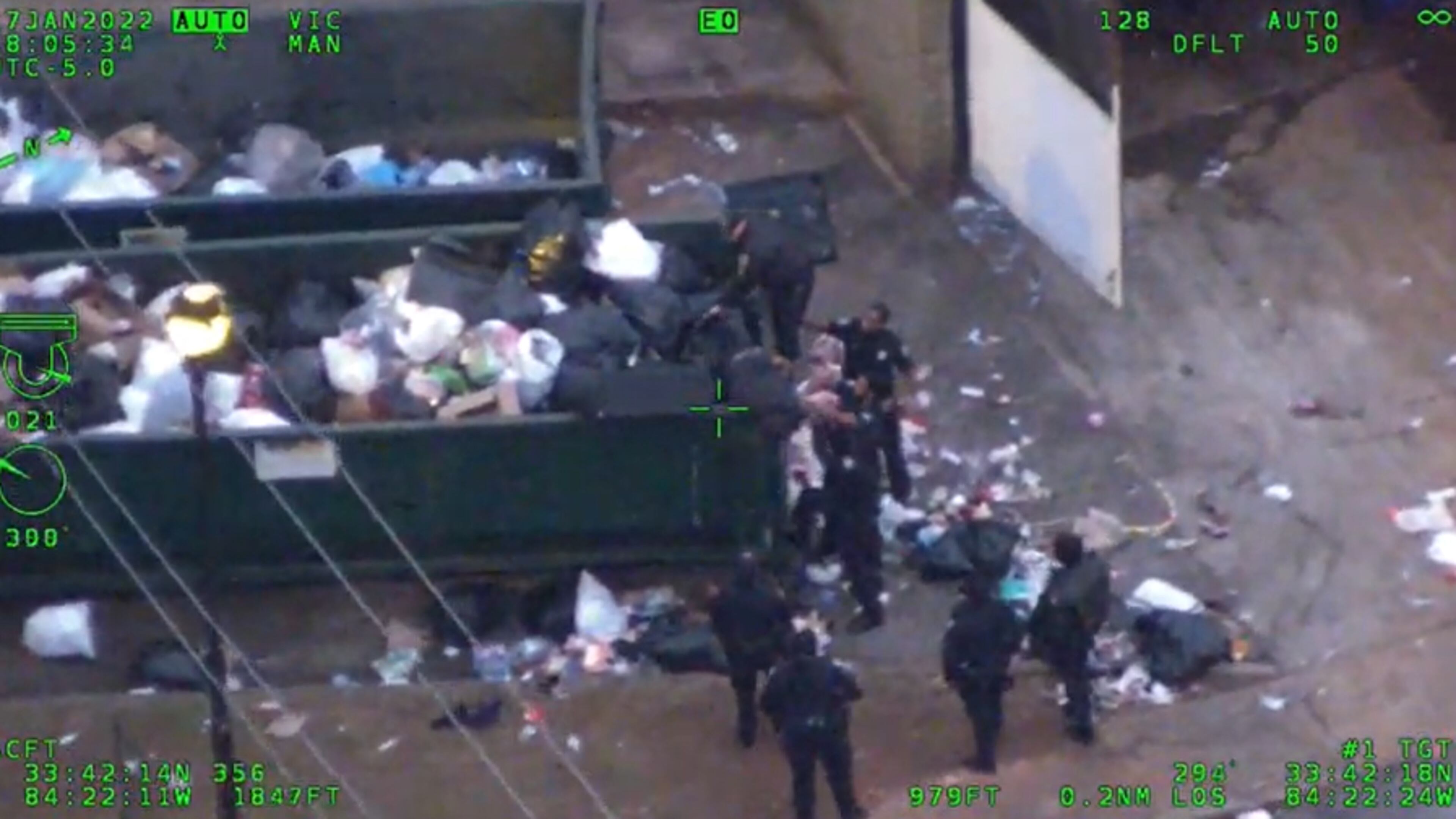 Police arrested a suspect who allegedly stole a car with a 1-year-old in the back seat Monday. The Atlanta Police Department's Air Phoenix unit tracked the suspect's heat signature, and officers found him hiding in a trash dumpster. (Credit: Atlanta Police Department)