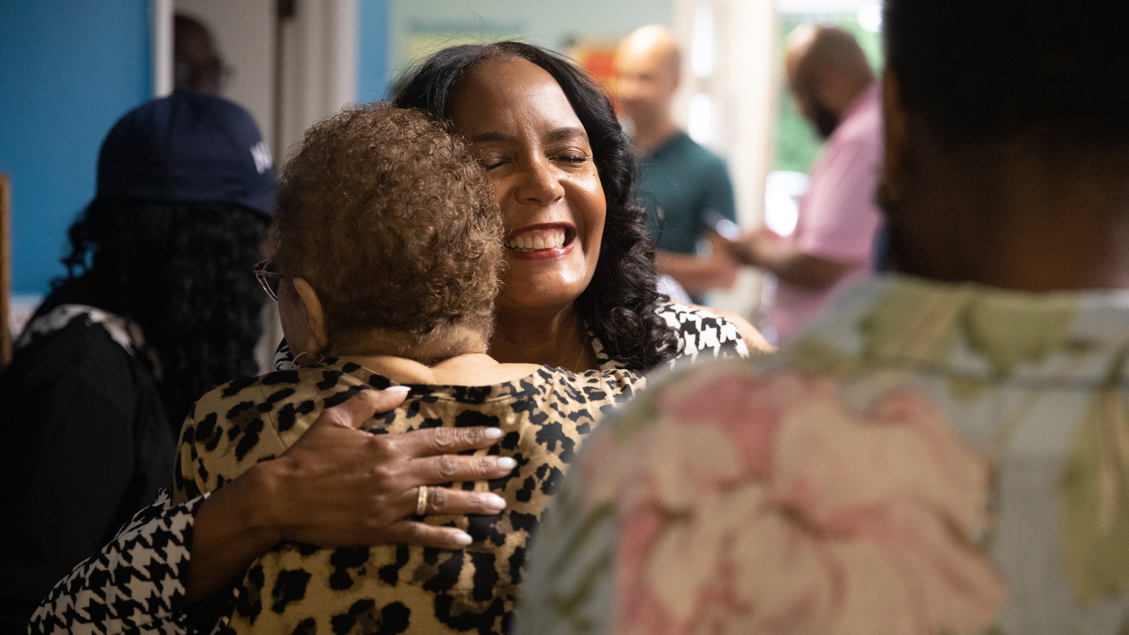 Former Atlanta Mayor Keisha Lance Bottoms hugs a supporter during a visit to the Kidz.com Child Development Center in Columbus on May 12, 2026, as part of her final statewide push ahead of the Democratic gubernatorial primary election. (Riley Bunch/AJC)