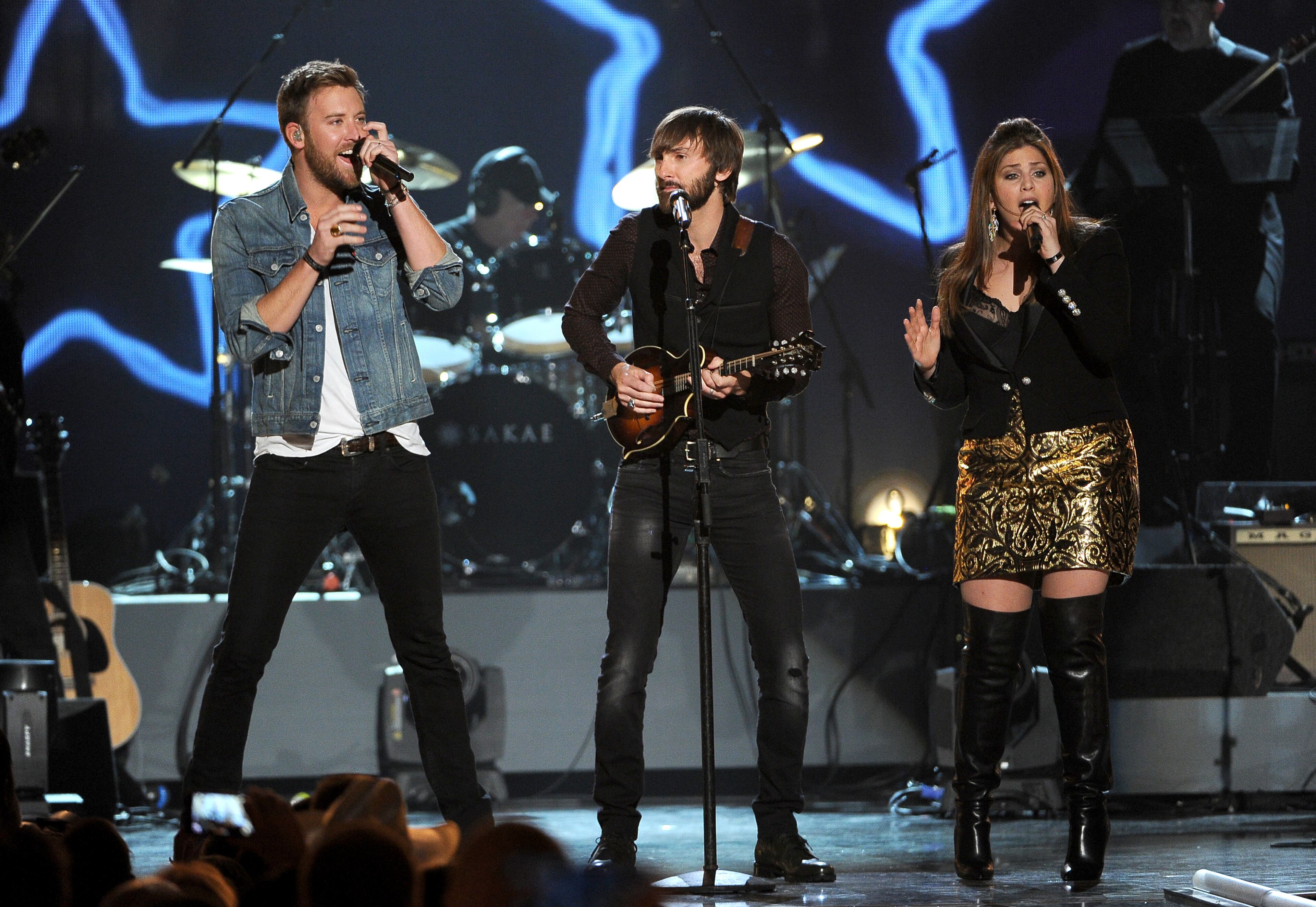 Charles Kelley, and from left, Dave Haywood and Hillary Scott, of the musical group Lady Antebellum, perform at ACM Presents an All-Star Salute to the Troops on Monday, April 7, 2014, in Las Vegas. (Photo by Chris Pizzello/Invision/AP)