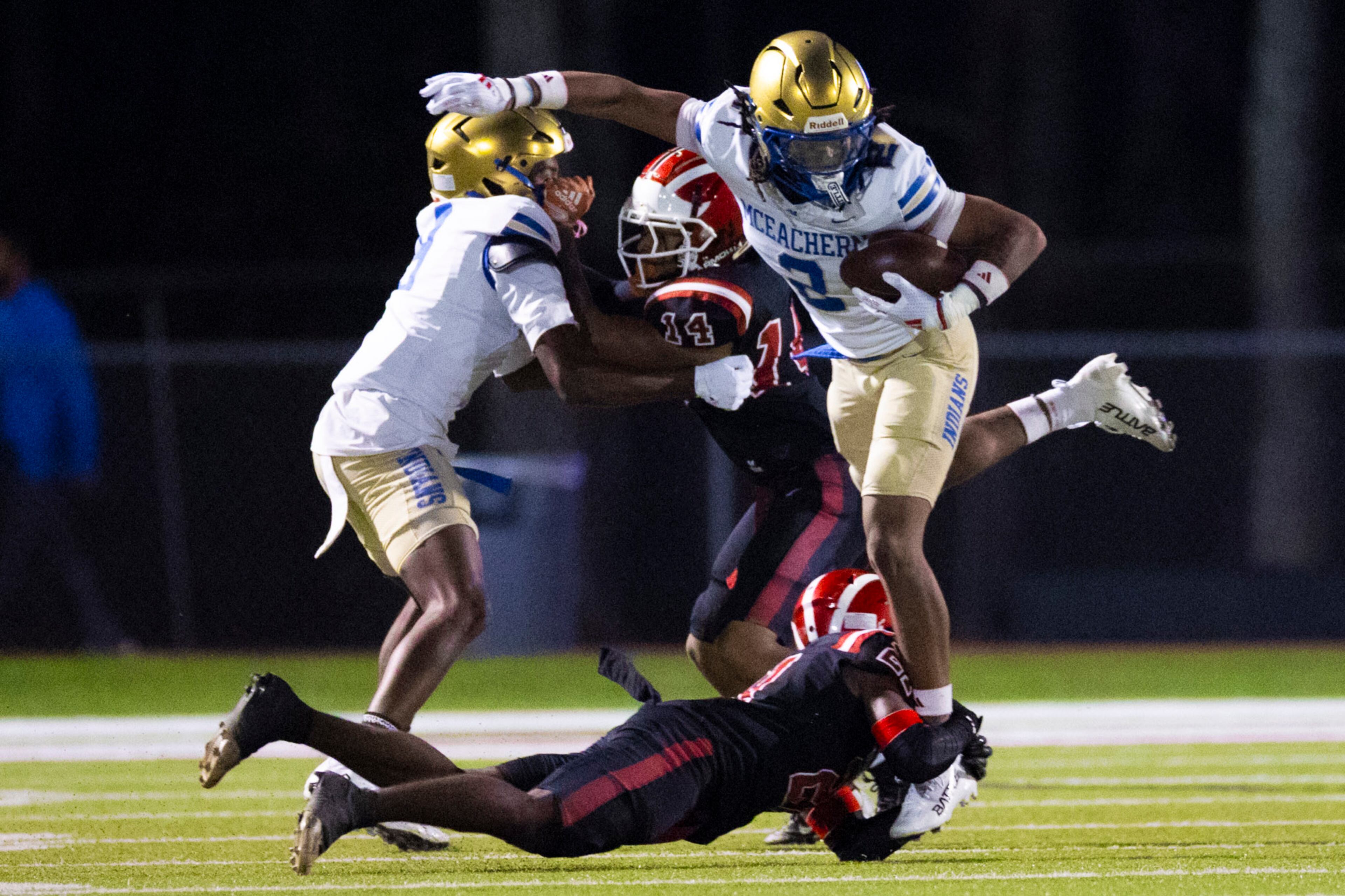 McEachern wide receiver Nalin Scott (right) dodges a tackle against Hillgrove at Cobb Energy Hillgrove Stadium in Powder Springs, GA on Friday, Oct. 17th, 2025. (Oscar Guevara Saenz for the AJC)