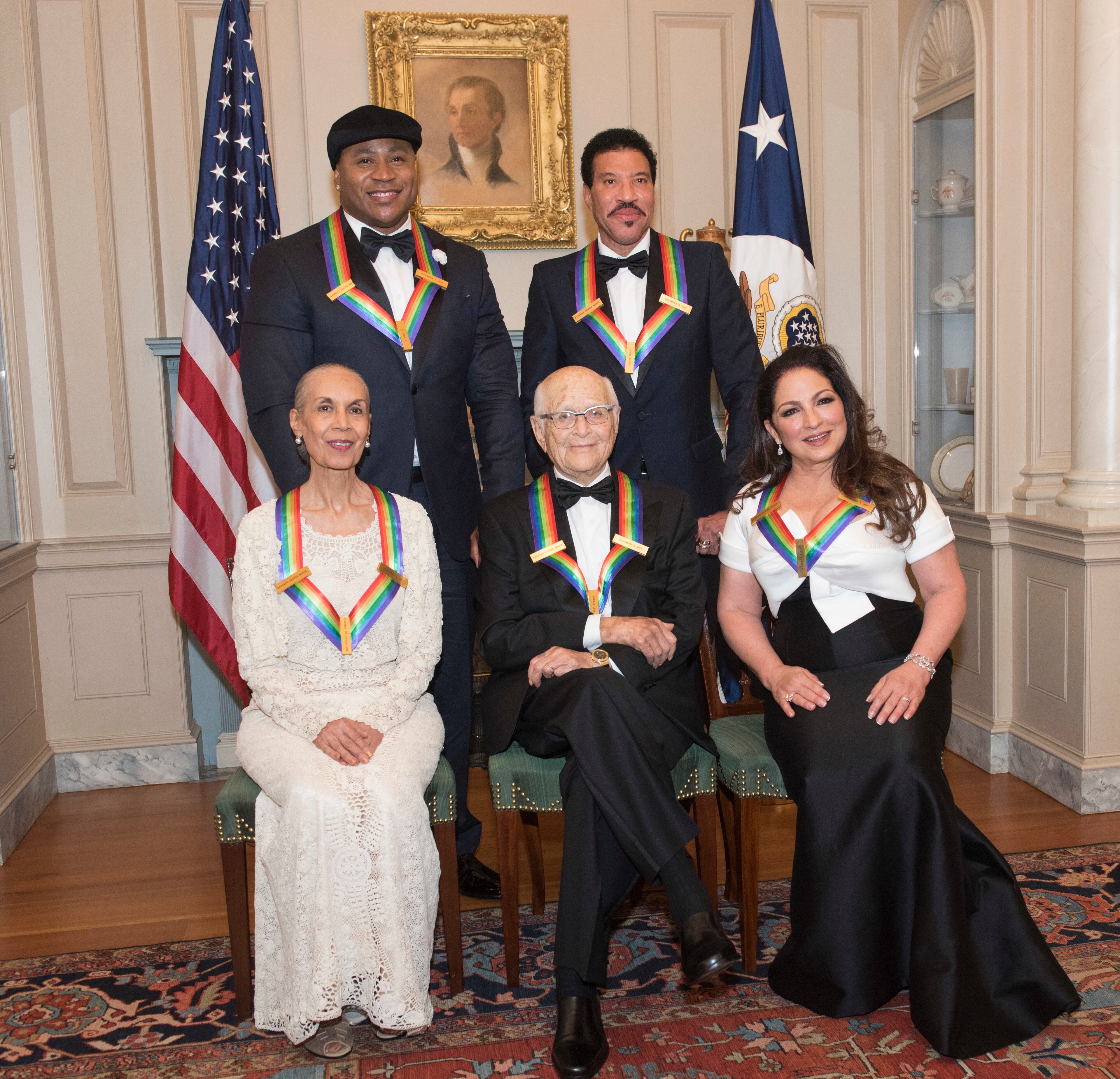 Front row from left, 2017 Kennedy Center Honorees Carmen de Lavallade, Norman Lear, Gloria Estefan, back row from left, LL Cool J, and Lionel Richie are photographed following the State Department dinner for the Kennedy Center Honors, Saturday, Dec. 2, 2017, in Washington. (AP Photo/Kevin Wolf)