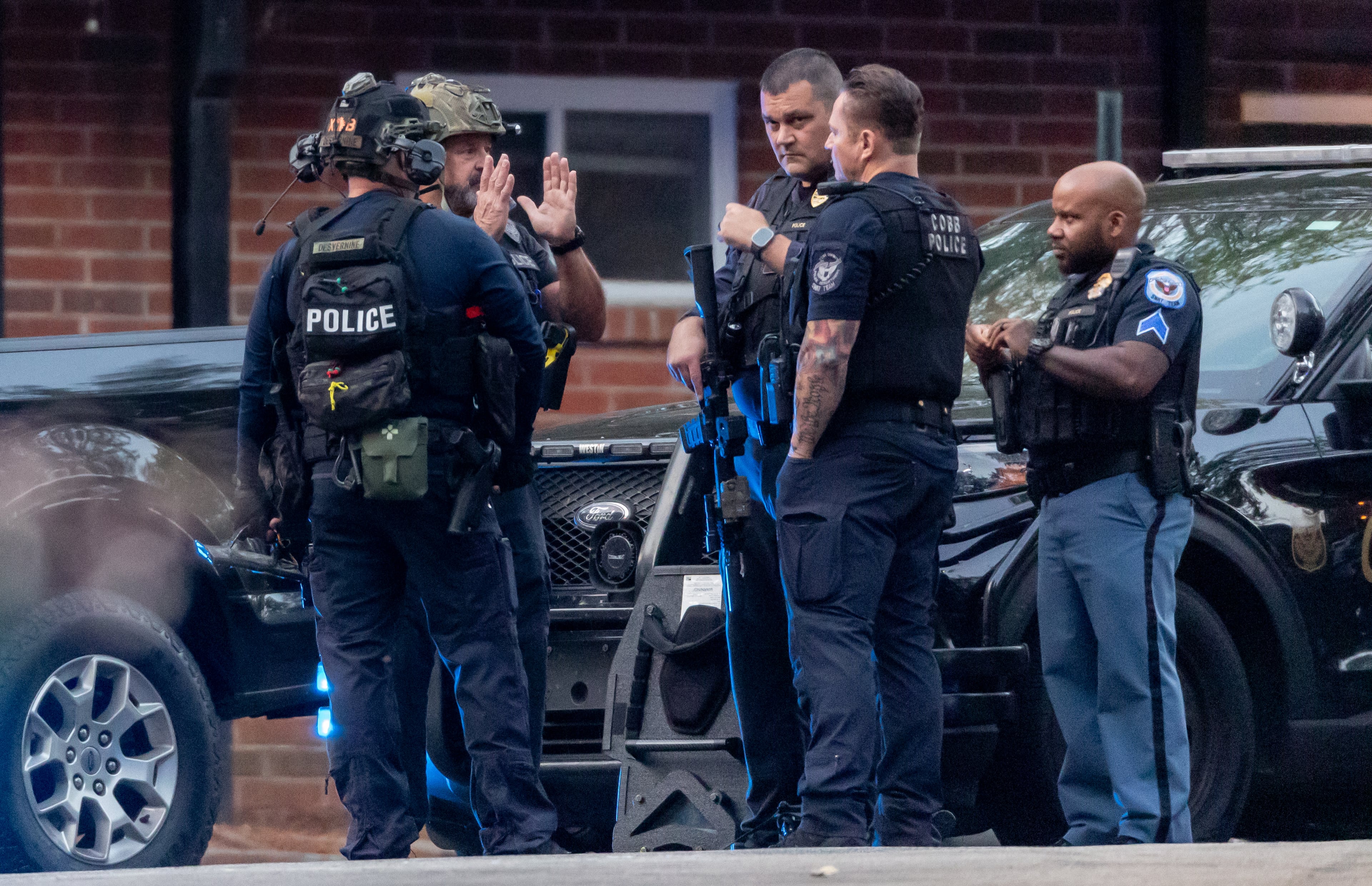 A man surrendered to Cobb County police after an hours-long SWAT operation Tuesday morning, Sept. 17, 2024 at the at the Belmont Crossing apartments located on Atlanta Road. Cobb County police told Channel 2 Action News they received a 911 call around 3:48 a.m. about shots fired at a person. Arriving SWAT teams gave multiple commands over a loud speaker for the man, who has not been identified, to come out of the apartment. The man exited the apartment around 9:50 a.m. (John Spink/AJC)