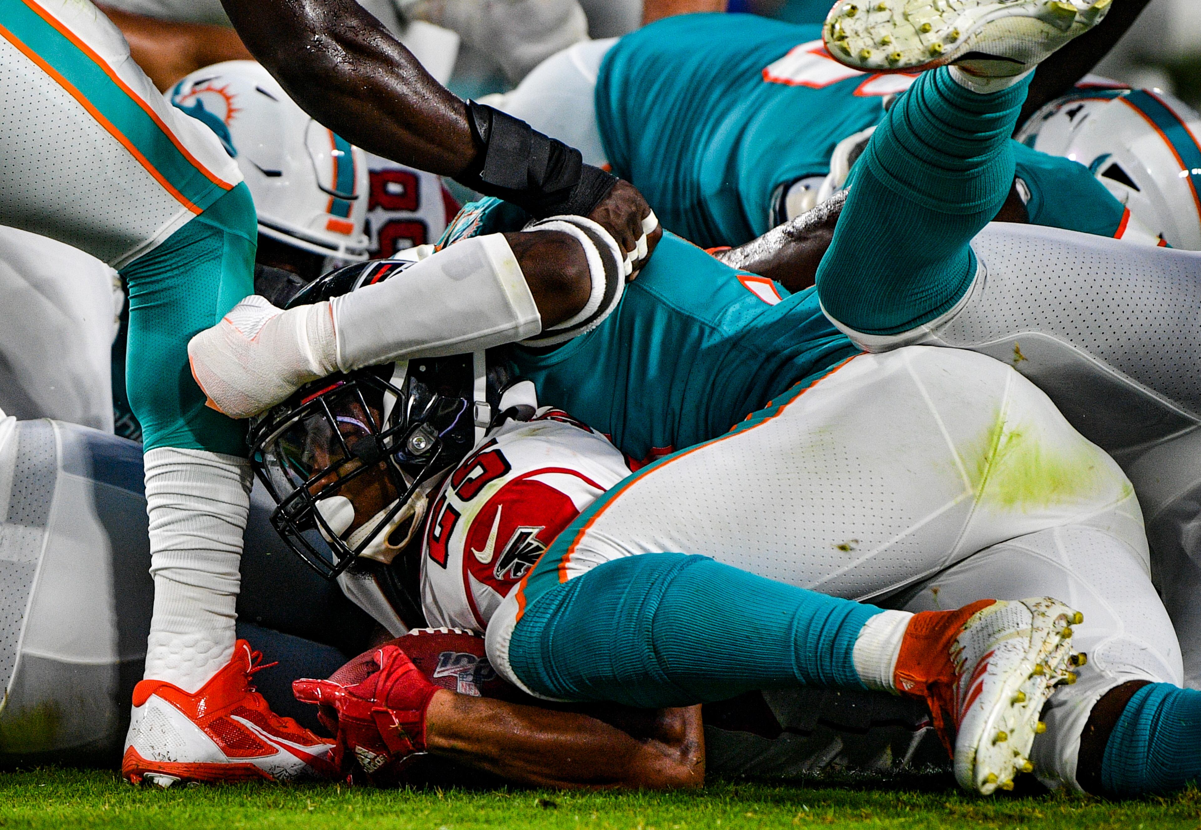 Ito Smith #25 of the Atlanta Falcons scores a touchdown in the first quarter during a preseason game against the Miami Dolphins at Hard Rock Stadium on August 8, 2019 in Miami, Florida. (Photo by Mark Brown/Getty Images)