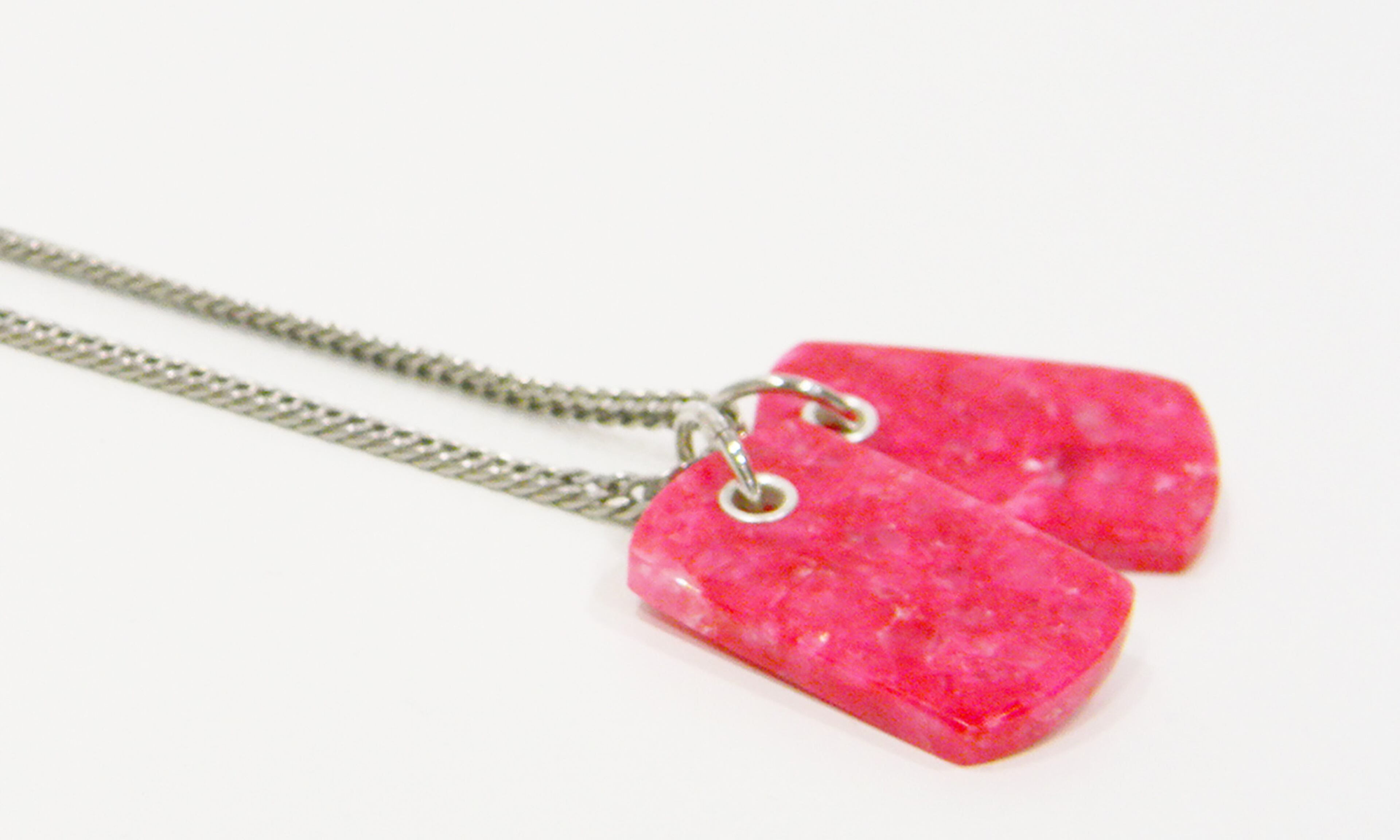 The Pink Calcite Dog Tag Necklace by L George Designs is available for $125 at Sandpiper and 100% of the proceeds will go to the Pink Ribbon Story Foundation.