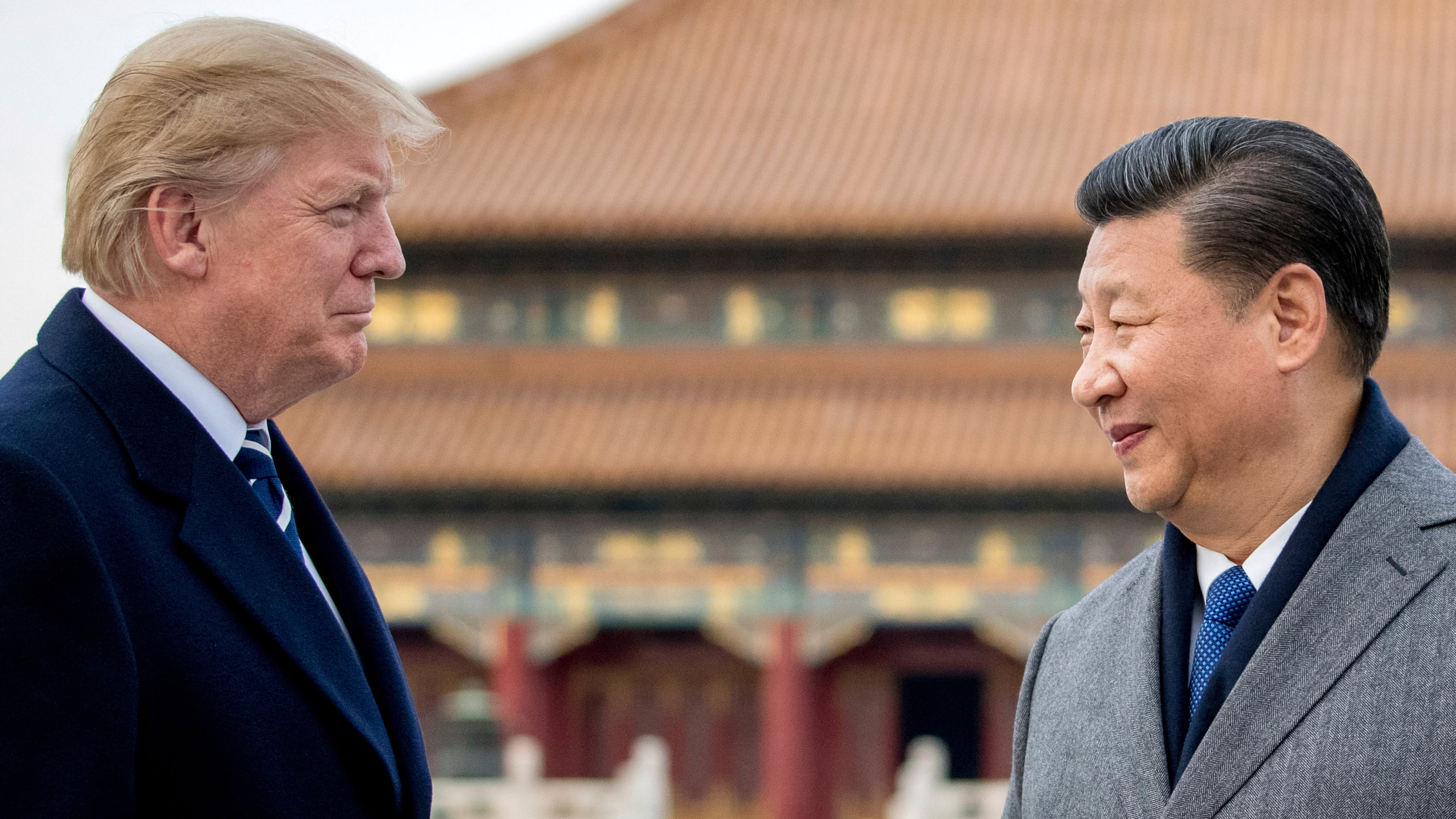 FILE - President Donald Trump, left, and Chinese President Xi Jinping tour the Forbidden City, Nov. 8, 2017, in Beijing, China. (AP Photo/Andrew Harnik, File)
