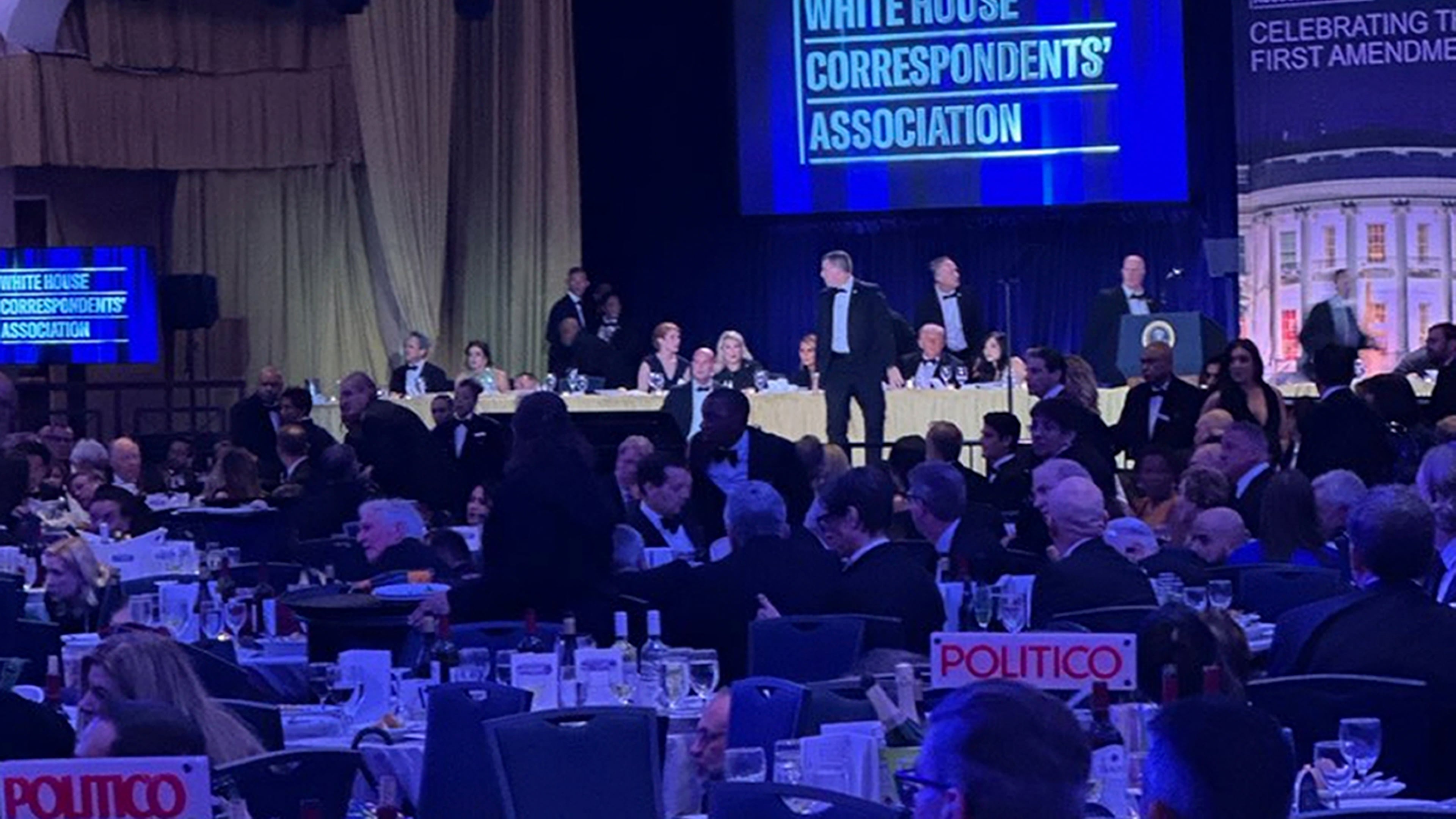 U.S. Secret Service agents respond near President Donald Trump during the White House Correspondents Dinner, Saturday, April 25, 2026, in Washington. (AP Photo/Alex Brandon)