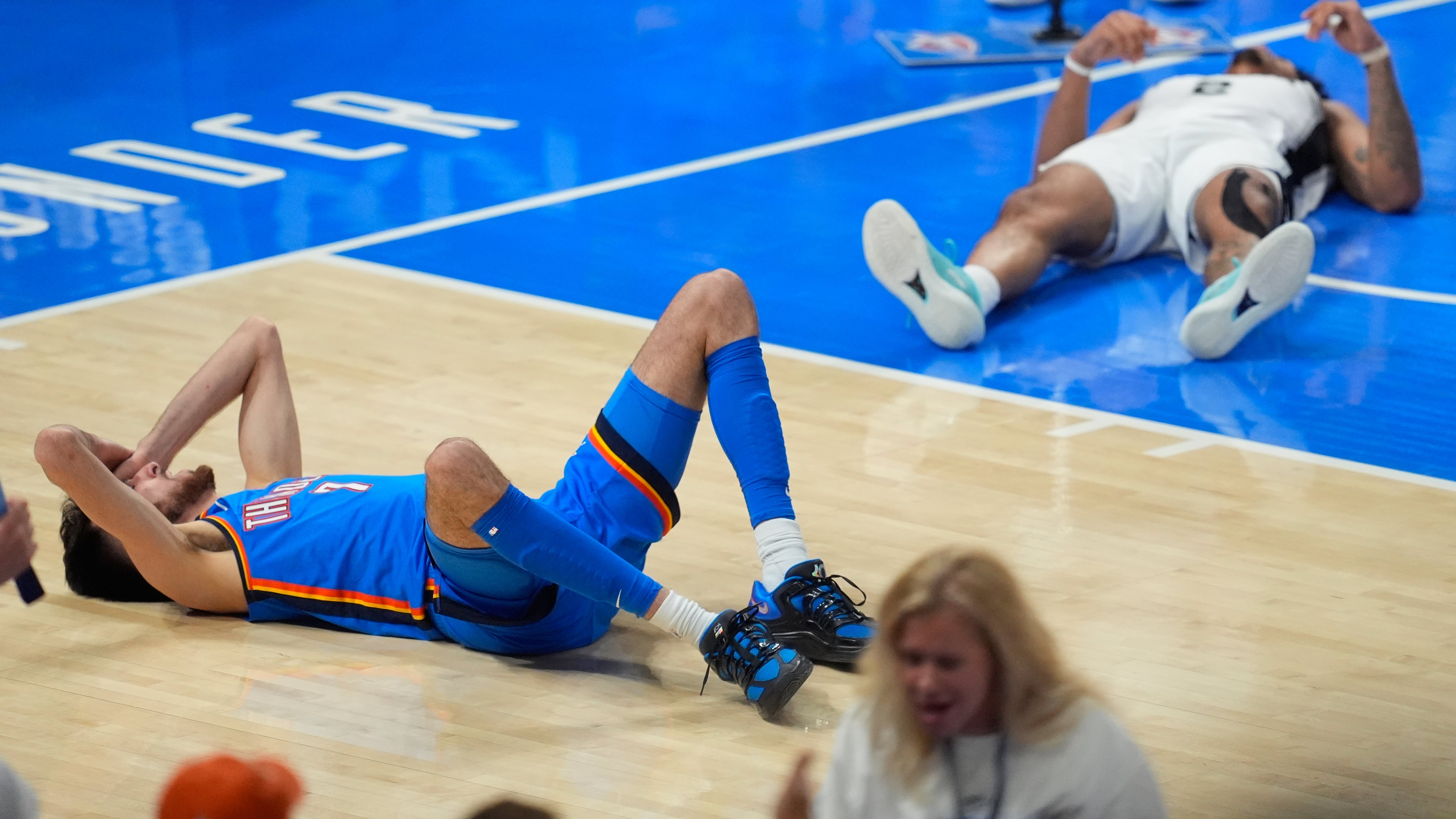 Oklahoma City Thunder center Chet Holmgren (7) and San Antonio Spurs guard Dylan Harper (2) react after a foul call during the second half of Game 2 in the Western Conference finals NBA basketball playoffs series Wednesday, May 20, 2026, in Oklahoma City. (AP Photo/Tony Gutierrez)