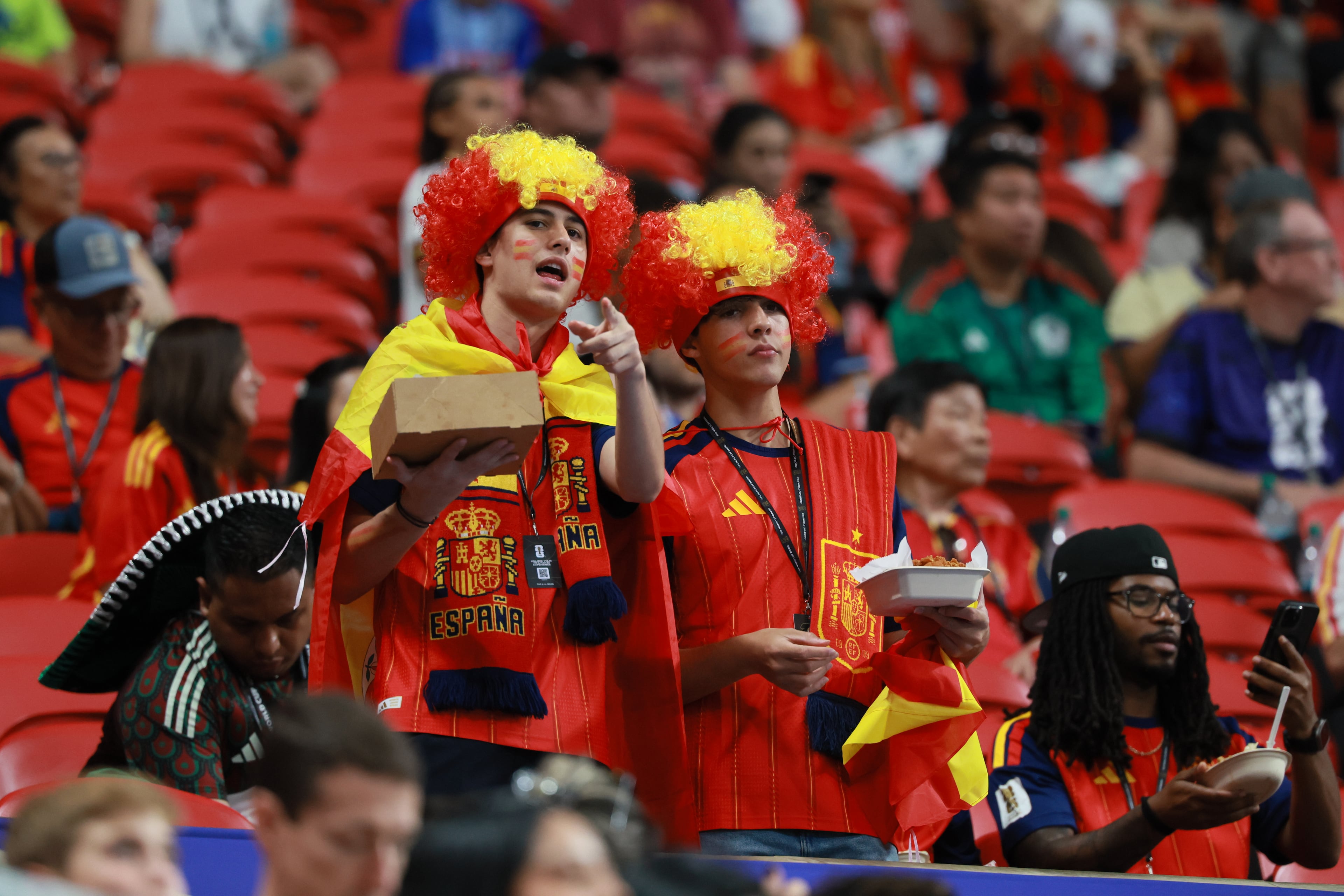 Fans of Spain snacking before the Spain vs. Cape Verde Group H match at Atlanta Stadium (Mercedes-Benz Stadium) on Monday, June 15, 2026. (Jason Getz/AJC)