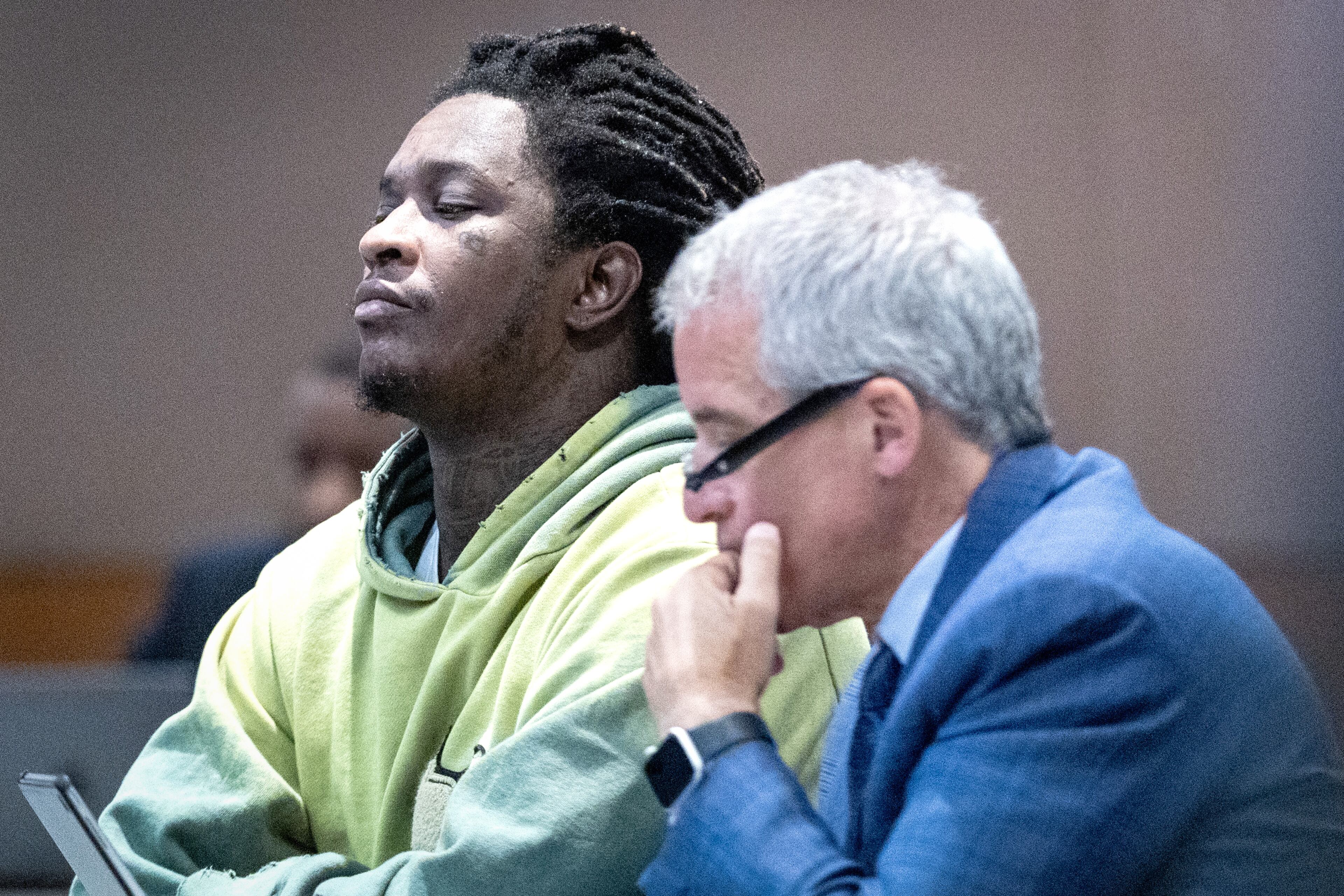 Atlanta rapper Young Thug listens to the judge at the Fulton County Courthouse during jury selection in the “Young Slime Life” gang case with his defense attorney Brian Steel in Atlanta Tuesday, September 12, 2023. (Steve Schaefer/steve.schaefer@ajc.com)