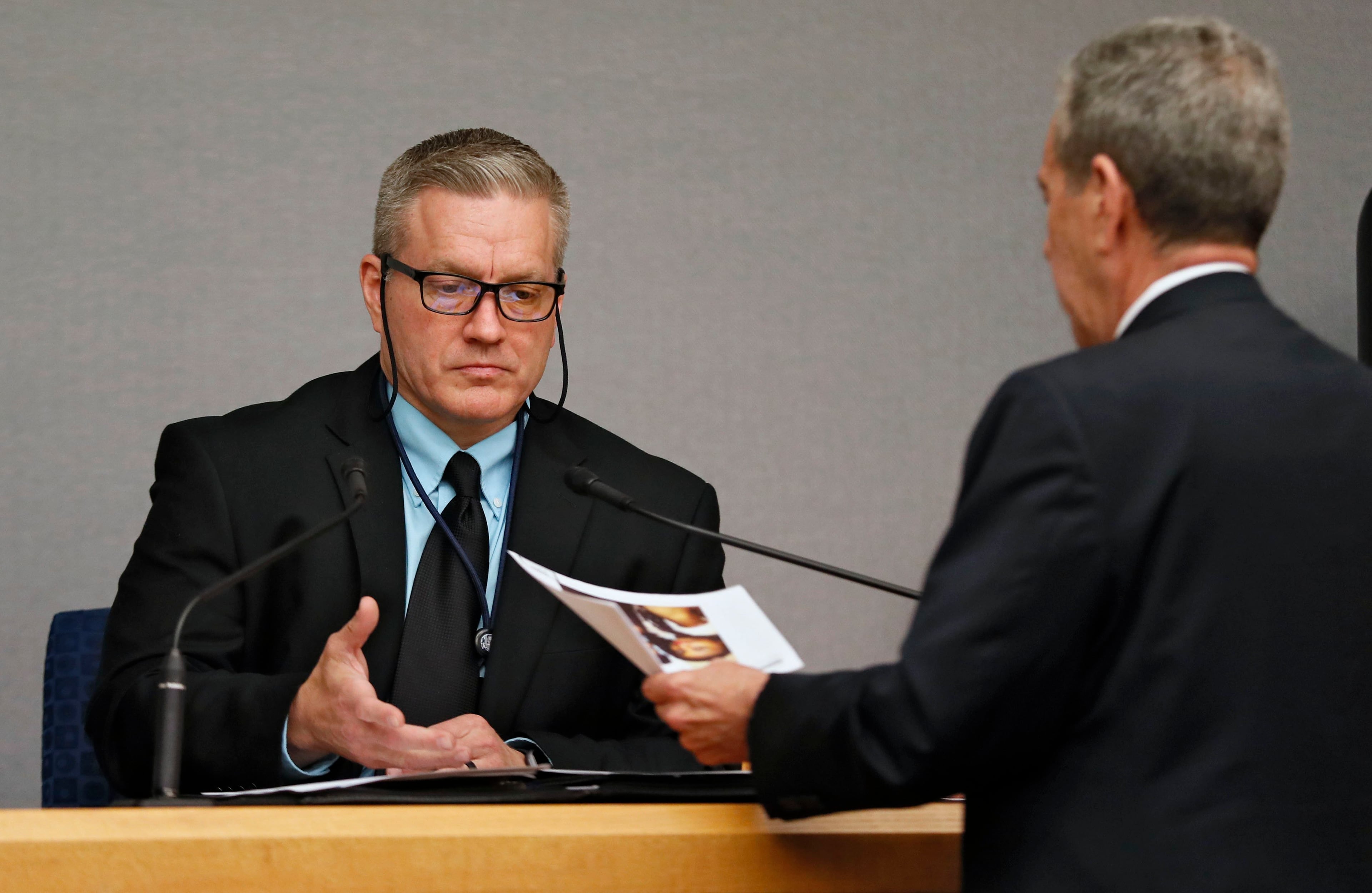April 26, 2019 - Lawrenceville - Chris Ford, a certified forensic examiner, is question by District Attorney Danny Porter about data retrieved from the phone of Eman Moss, husband of Tiffany Moss. The prosecution continued it's case in the third day of the Tiffany Moss murder trial. Moss, who is representing herself, is accused of intentionally starving her 10-year-old stepdaughter Emani to death in the fall of 2013. Bob Andres / bandres@ajc.com