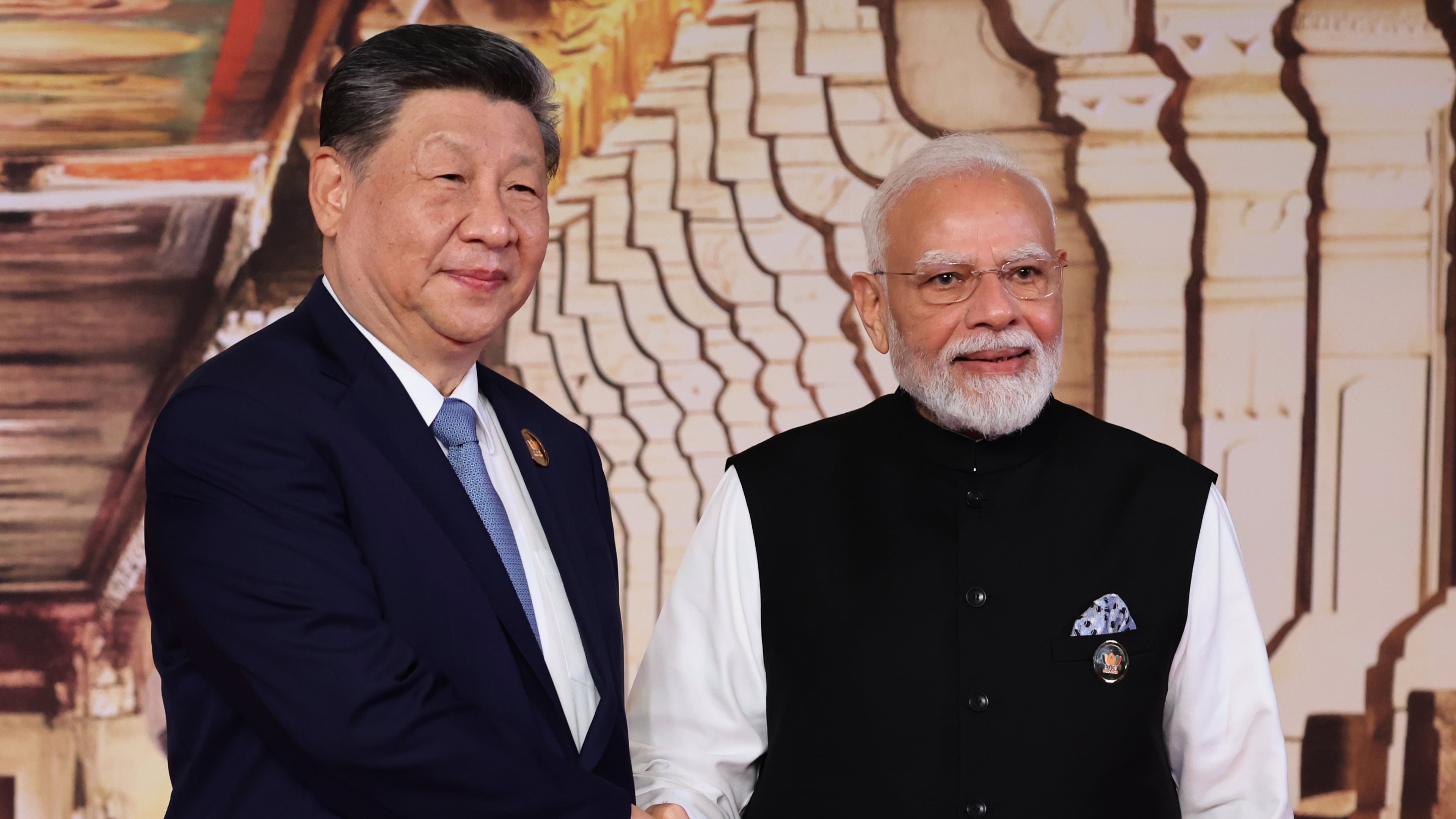 Chinese President Xi Jinping, left, and Indian Prime Minister Narendra Modi pose for a photo during an official welcome ceremony of the BRICS Summit in New Delhi, India, on Saturday, Sept. 12, 2026. (Alexander Kazakov, Sputnik, Kremlin Pool Photo via AP)