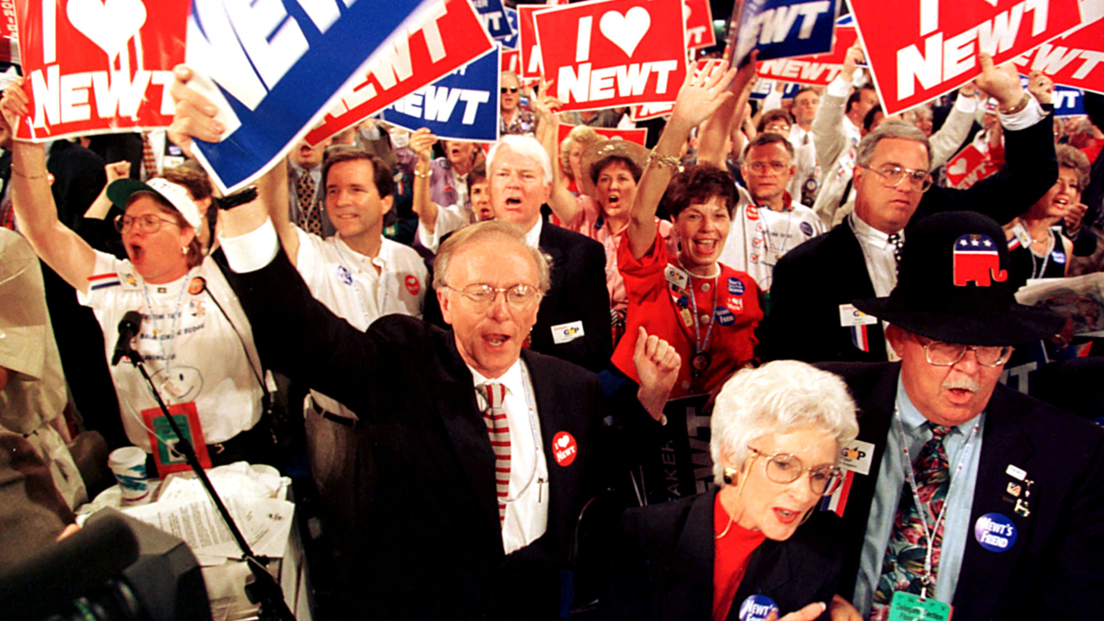 Members of the Georgia delegation cheer House Speaker Newt Gingrich during his speech before the 1996 Republican National Convention in San Diego. At bottom from left, Senator Paul Coverdell, Dot Burns from Gainesville, Ga., and Brigss Goggans, of Smyrna, Ga. (Photo by Rick McKay/Washinton Bureau)