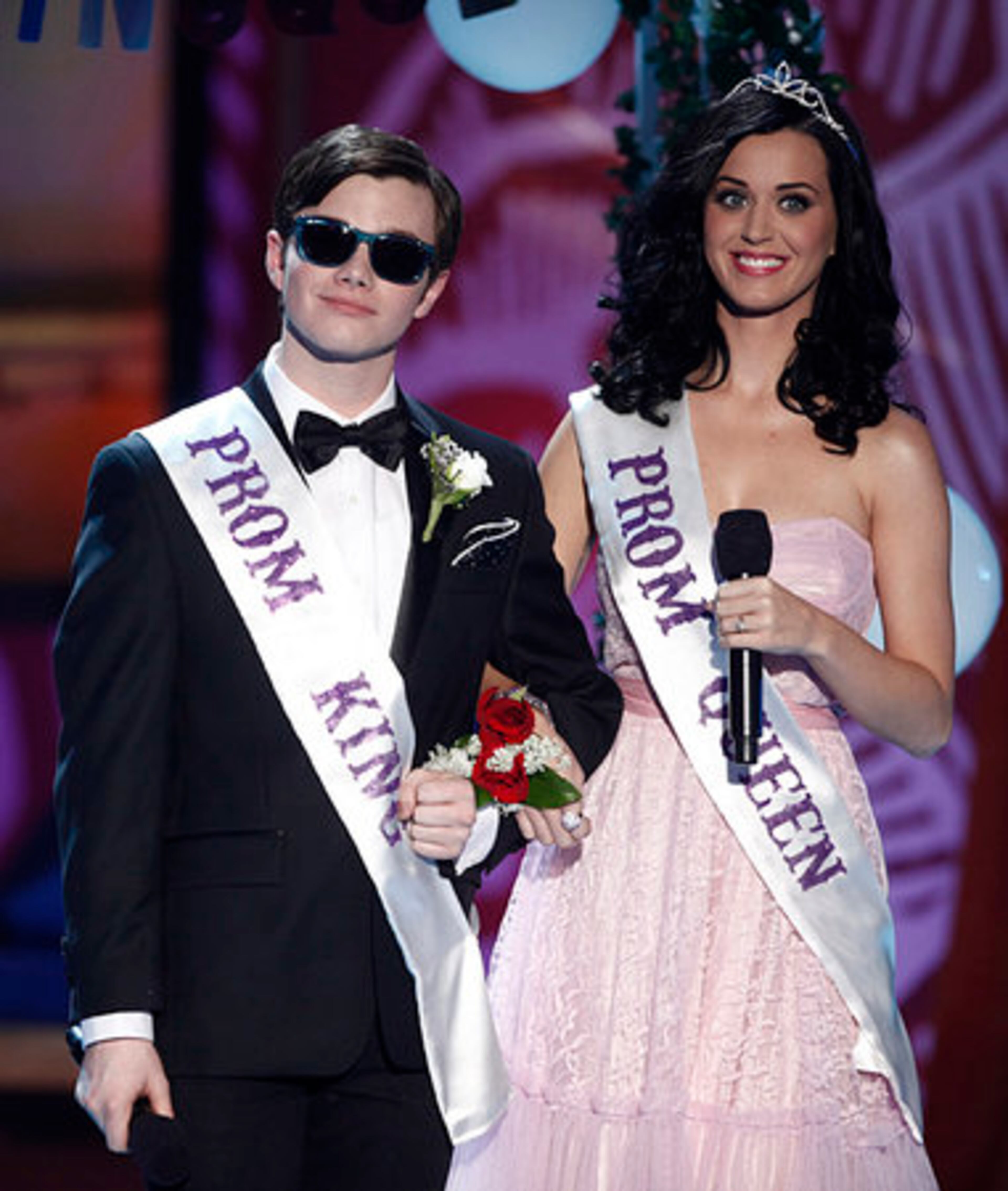 Actor Chris Colfer and host Katy Perry on stage.
