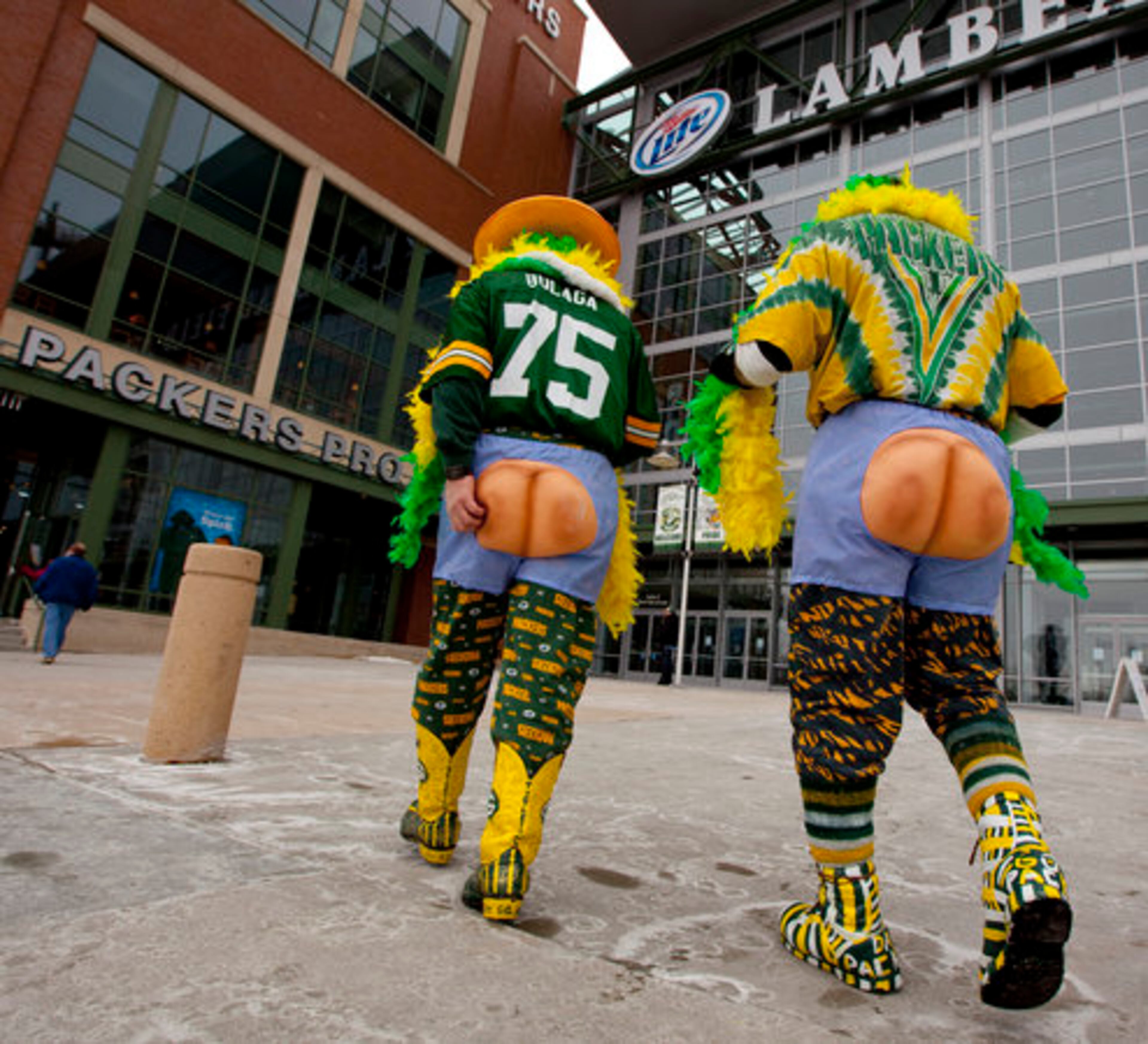 Packers fans Jeff Knott, left, and Charlie Donner of Chippewa Falls, Wis. head into Lambeau Field Saturday, Feb. 5, 2011, in Green Bay, Wis. Knott and Donner say they headed to Green Bay to be part of the Super Bowl atmosphere and will stay in town until after "Return To Titletown" celebration on Tuesday, Feb. 8.