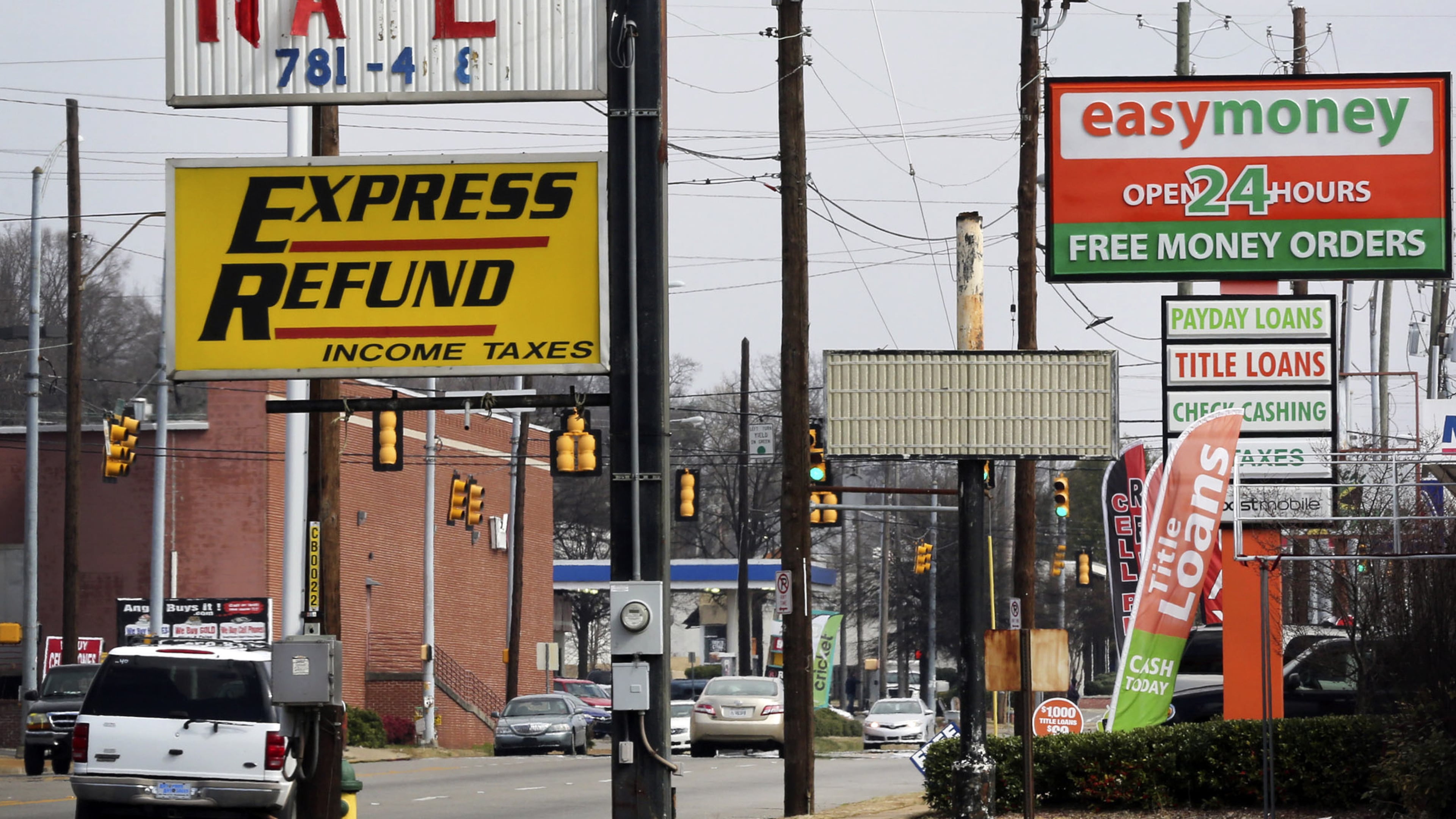 Signs advertise short-term loans in Birmingham, Alabama, in 2015. The Georgia Supreme Court ruled Monday that out-of-state lenders are subject to the state’s prohibitions against high-cost payday loans. Photo: Gary Tramontina/BLOOMBERG