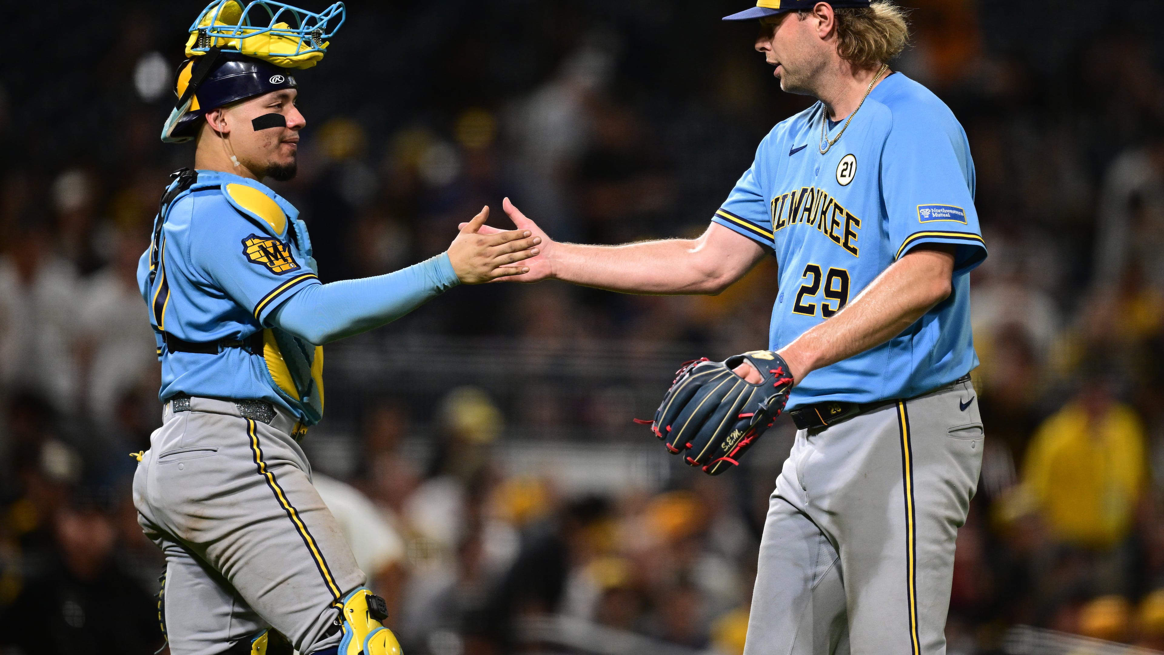 Milwaukee Brewers pitcher Trevor Megill is congratulated by catcher William Contreras after the Brewers defeated the Pittsburgh Pirates in a baseball game, Tuesday, Sept. 15, 2026, in Pittsburgh. (AP Photo/David Dermer)