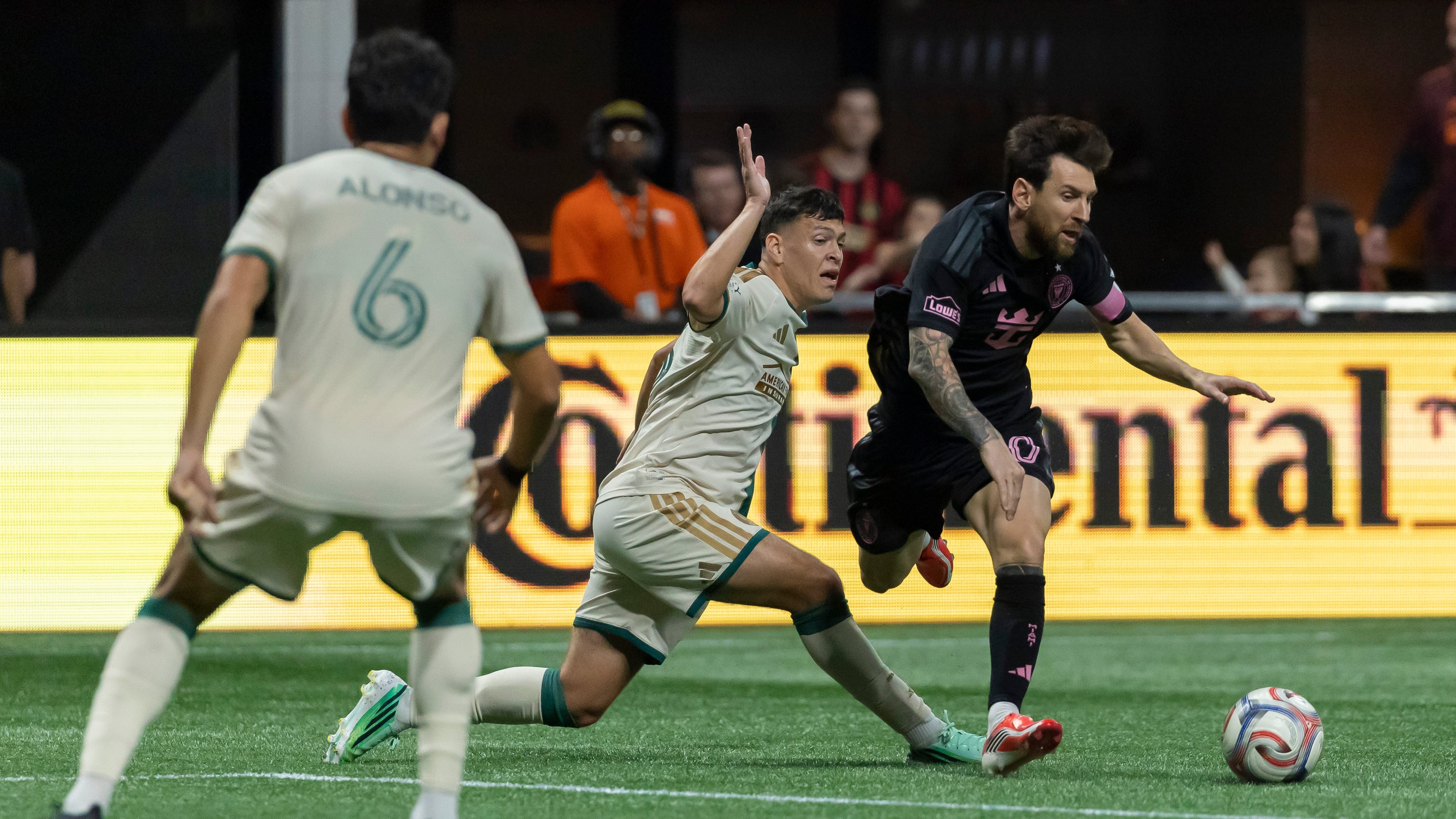 Atlanta United defender Elías Báez (second from right) fouls Inter Miami forward Lionel Messi (right) during the first half of an MLS soccer match Saturday, Oct. 17, 2026, in Atlanta. (Vasha Hunt/AP)