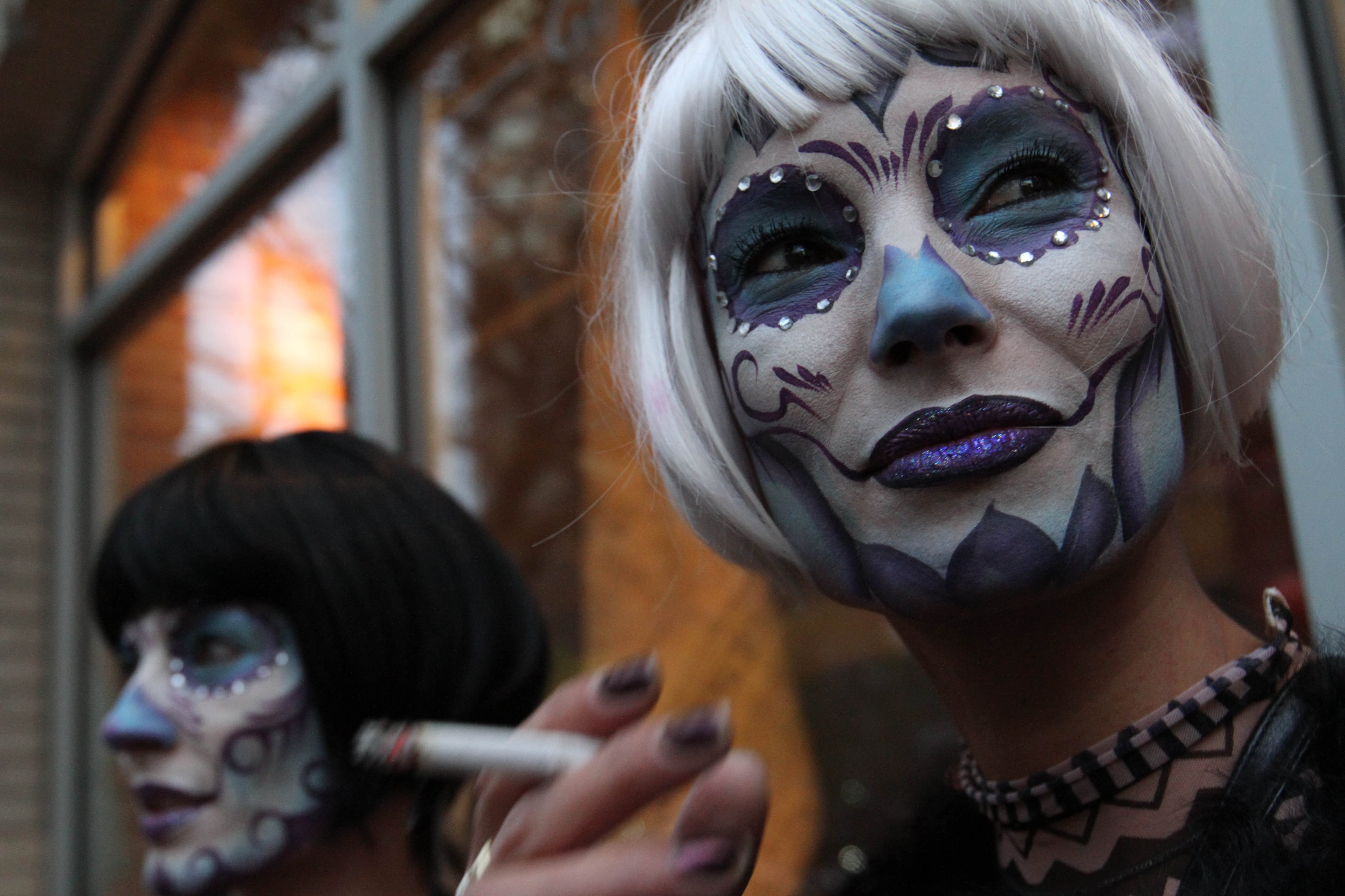 Angele Blank, right, and Virginia Promeyrat wait for the start of the Greenwich Village Halloween Parade, Saturday Oct. 31, 2015, in New York. (AP Photo/Tina Fineberg)