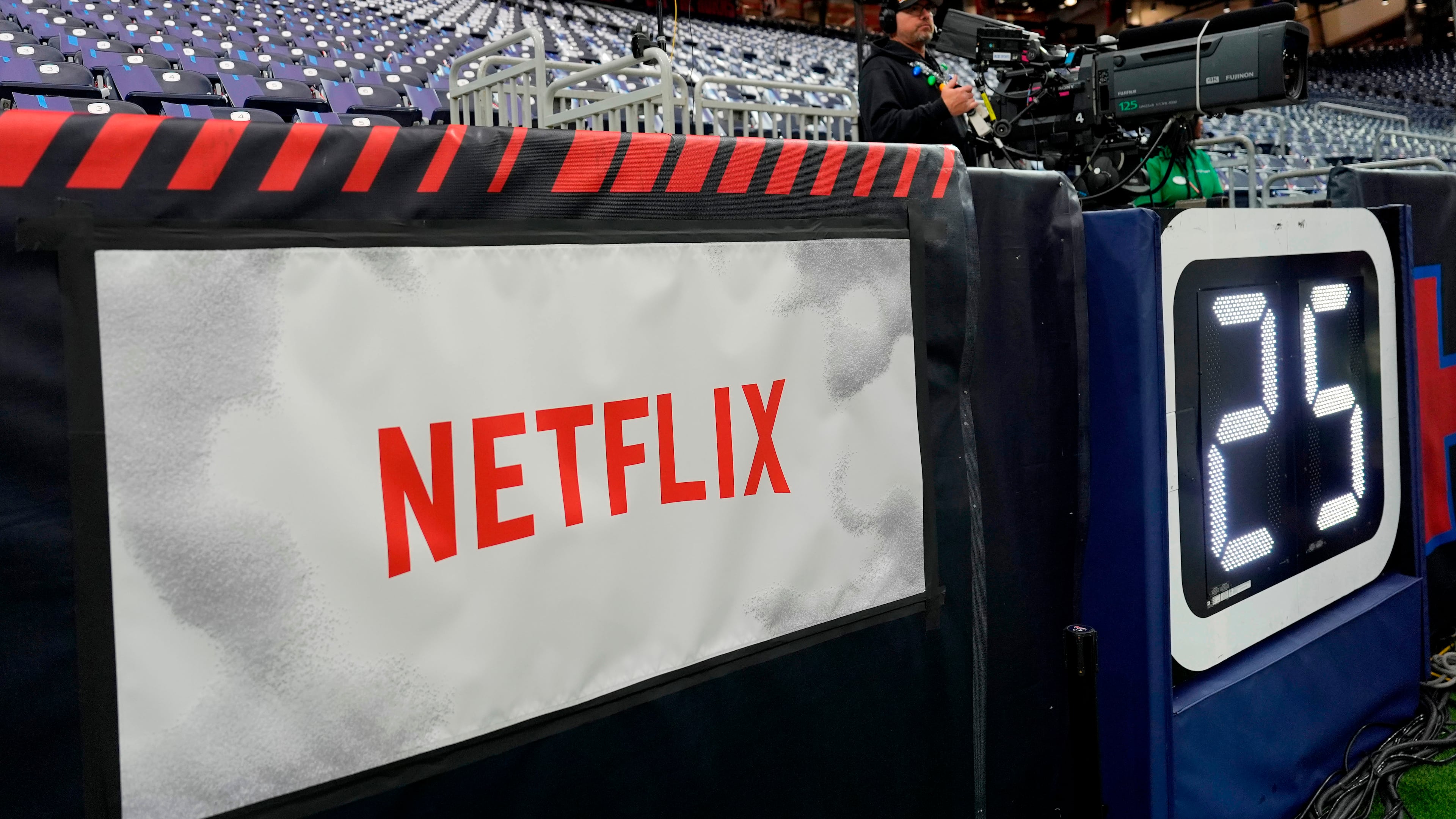 FILE - A Netflix banner is seen before an NFL football game between the Houston Texans and the Baltimore Ravens, Dec. 25, 2024, in Houston. (AP Photo/David J. Phillip, File)