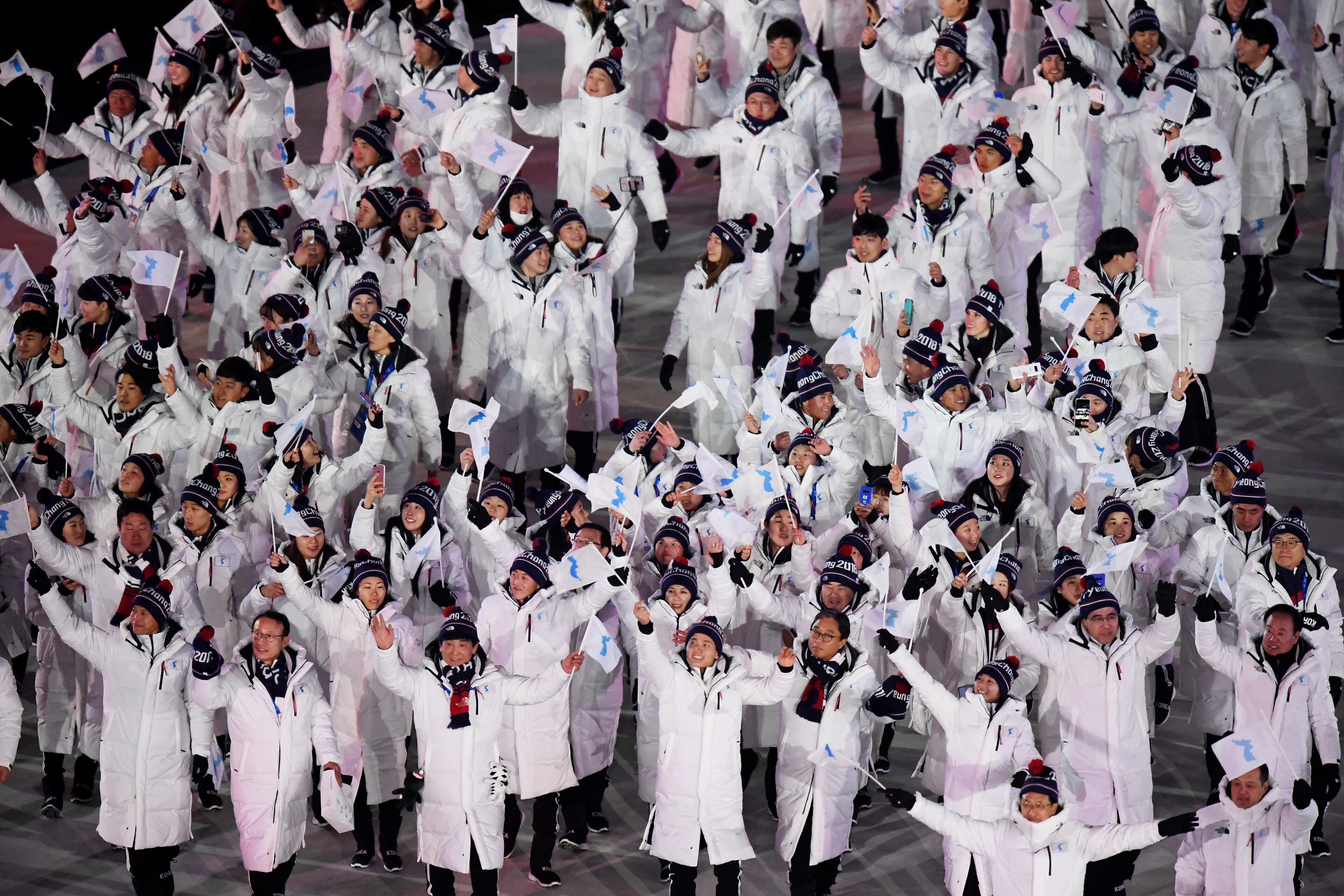 PYEONGCHANG-GUN, SOUTH KOREA - FEBRUARY 09: The North Korea and South Korea Olympic teams enter together under the Korean Unification Flag during the Parade of Athletes during the Opening Ceremony of the PyeongChang 2018 Winter Olympic Games at PyeongChang Olympic Stadium on February 9, 2018 in Pyeongchang-gun, South Korea. (Photo by Pool - Frank Fife/Getty Images)